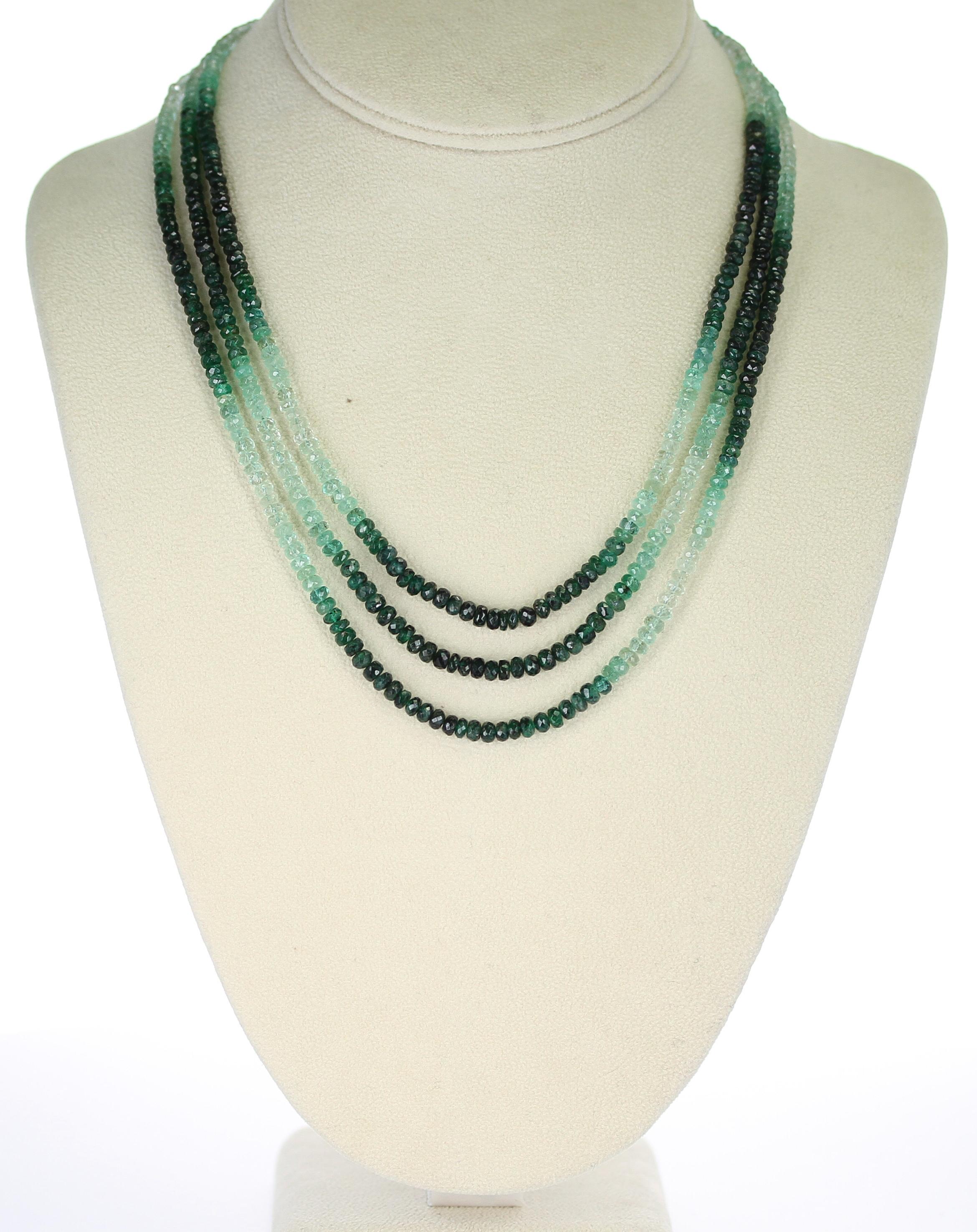 A Genuine & Natural Shaded and Faceted Emerald Beads Necklace with 3 strands and a 14K Yellow Gold Clasp. The necklace weighs 166 carats, the length ranges from 17.50 to 19.25 inches, and the size of the beads range from 3MM to 4MM. 

We can also