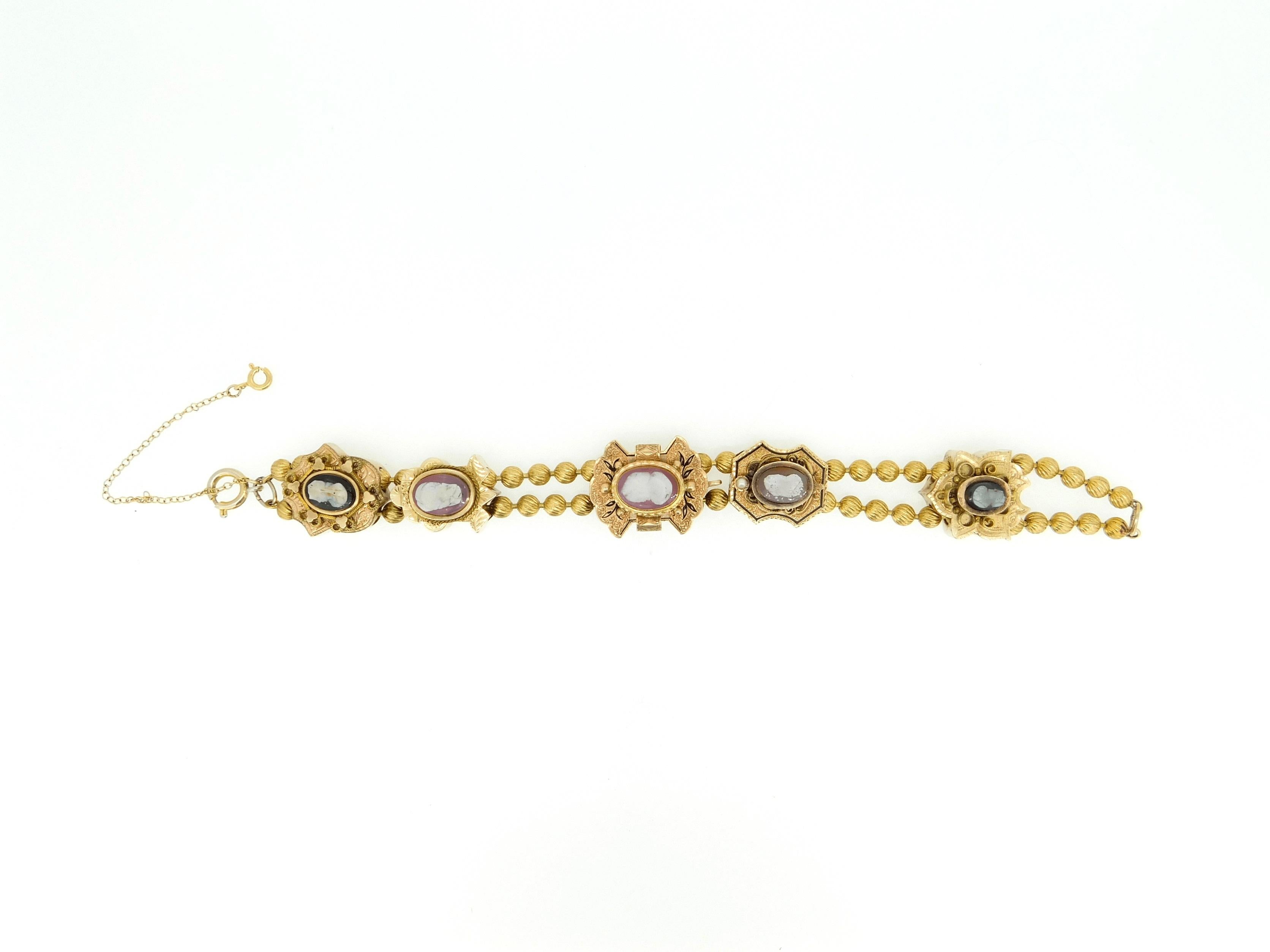 Genuine Natural Stone Cameo Victorian XL Gold Slide Bracelet (#J4362)

Victorian cameo bracelet made with yellow and rose gold extra large slides. It features three brown and white stone cameo 14k gold slides, and two gold filled slides with black