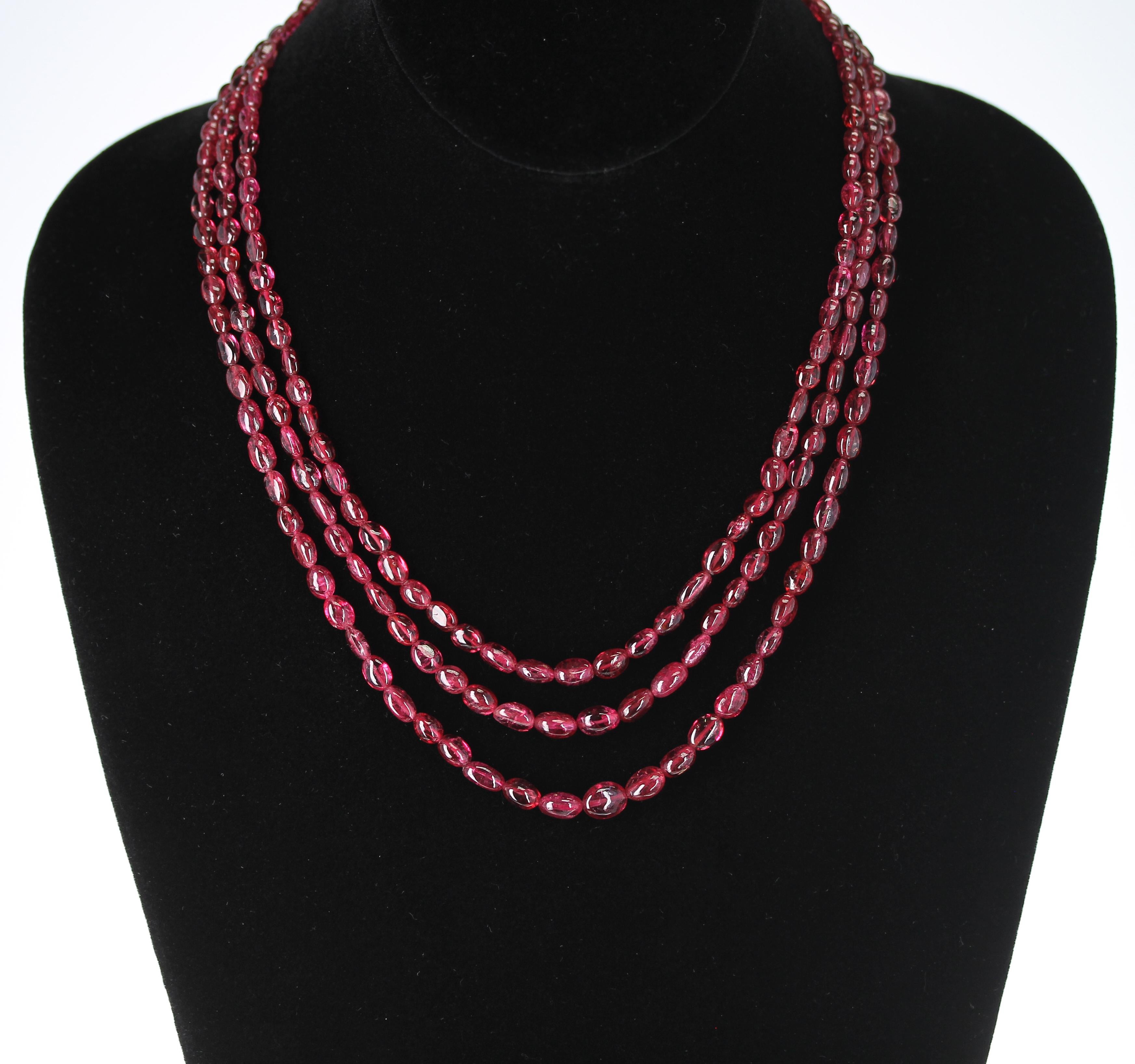 A Genuine & Natural Tumbled & Smooth Spinel Beads Necklace with 3 Strands, and a 14K Clasp. The necklace weighs 238 carats, the length is from 17.50 to 19.50 inches, and the size of the beads range from 4MM to 8MM. 
We can also customize the