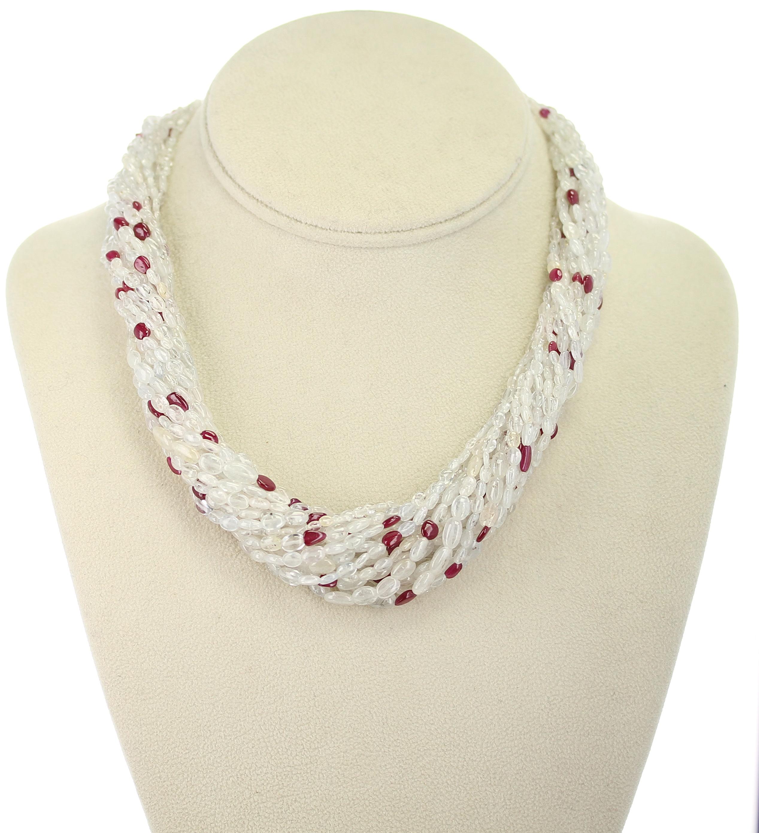 A Genuine & Natural Yellowish White Sapphire Plain Tumbled Beads with Ruby Choker Necklace consisting of 17 Lines weighing 680 carats. The clasp is 18 Karat. The length is 18