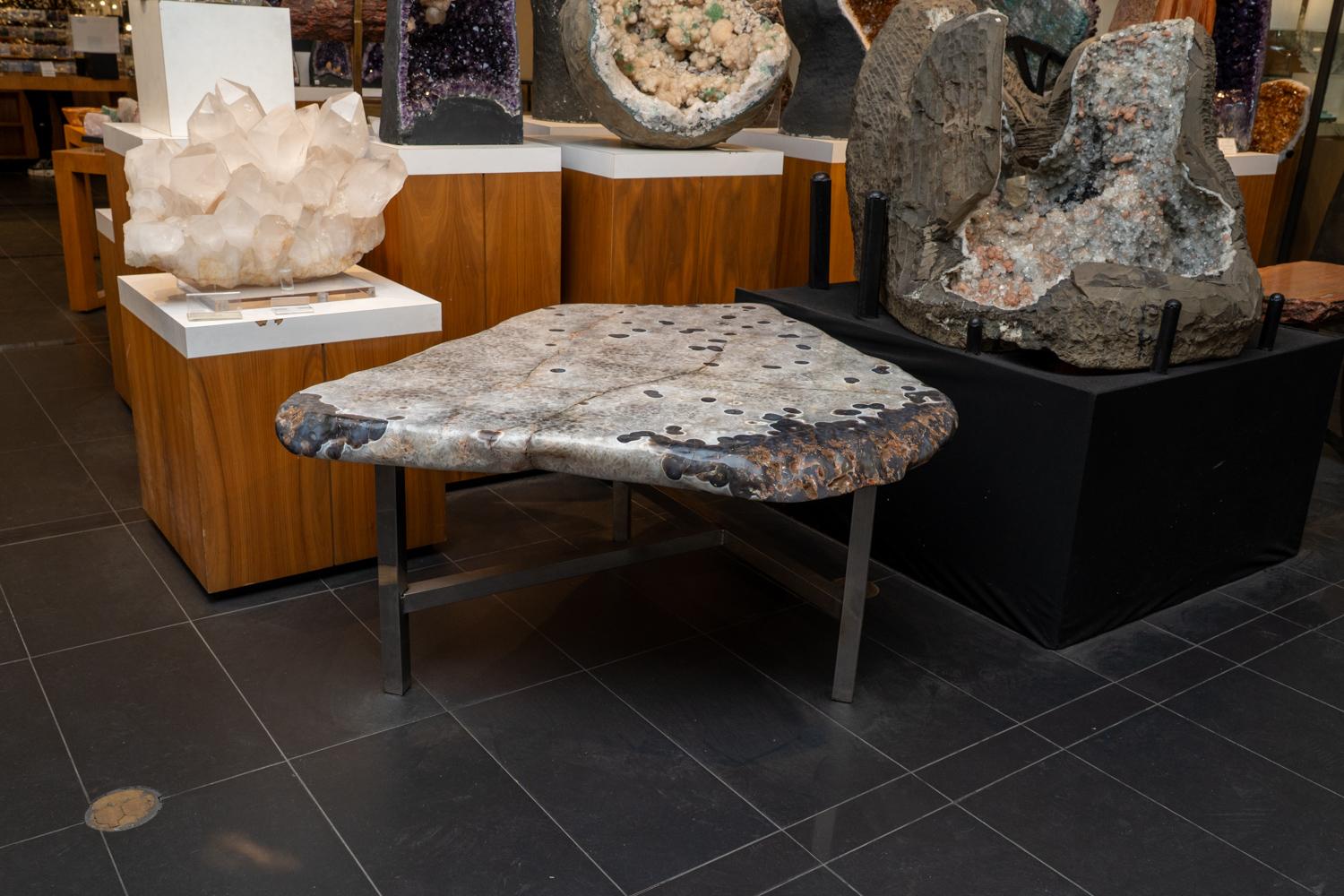 Transform your space with this beautifully one of a kind Agate table, hand crafted from top-quality, natural Agate. This stunning piece brings an organic element into any living room, and makes a statement while blending seamlessly with your