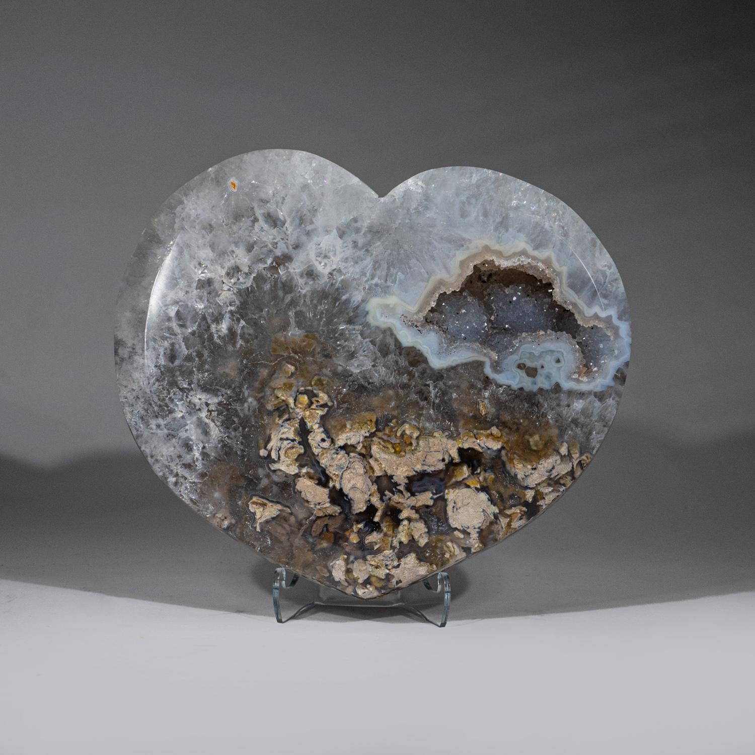 High quality, handmade polished natural Agate geode heart. This heart is carved from a solid cluster of Agate crystal with bright yellow and white coloration. 

Agates are grounding stones, bringing about an emotional physical and intellectual