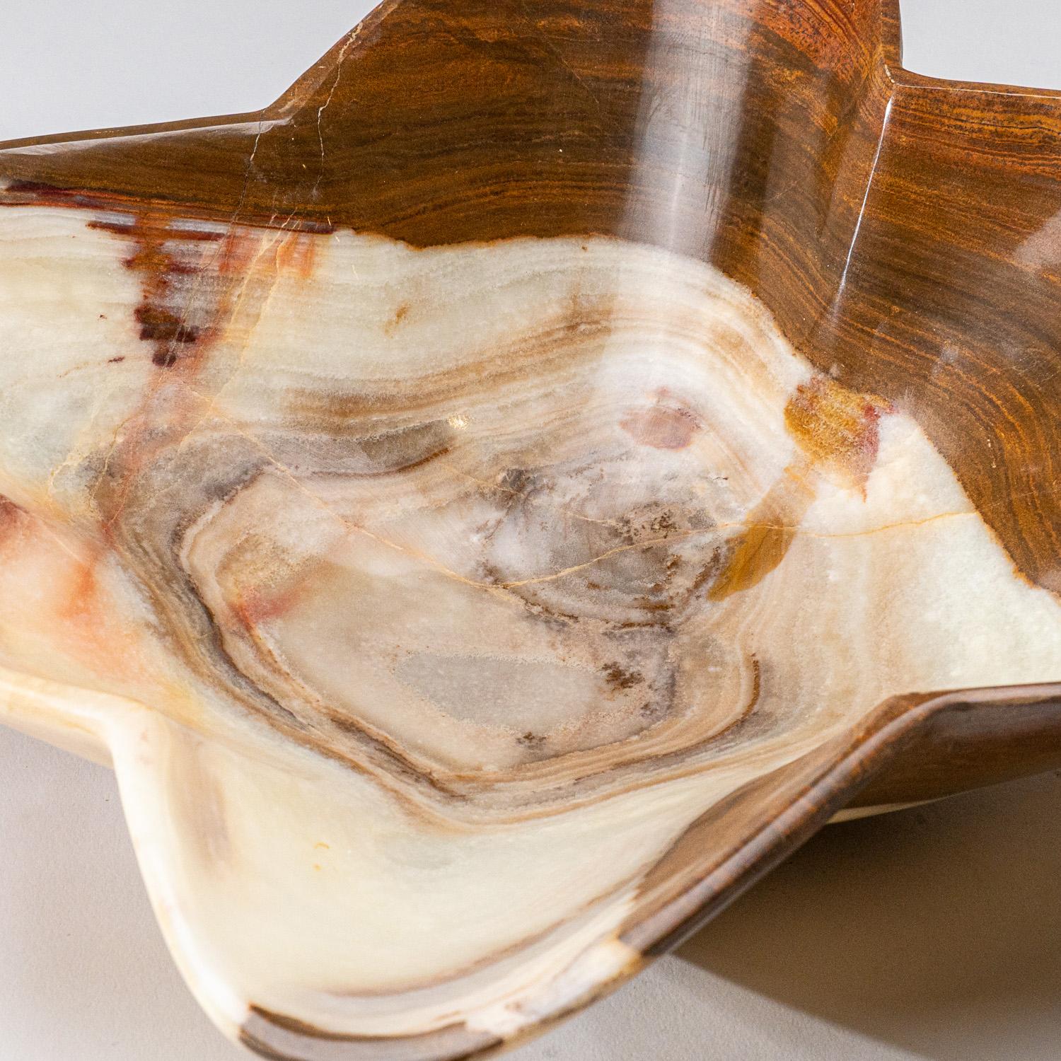 One-of-a-kind, solid mid sized free-form natural onyx decorative bowl carved out of a single chunk of banded natural onyx. This incredible piece is polished to a mirror finish. This unique piece blends natural onyx shades of green, white, honey and