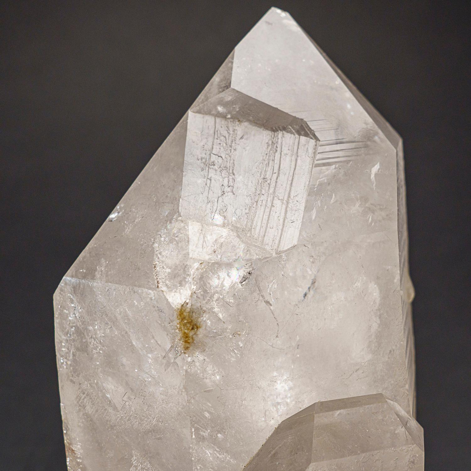 This Brazilian clear quartz crystal point is of top museum quality, with a polished mirror finish on all sides. Known as the 
