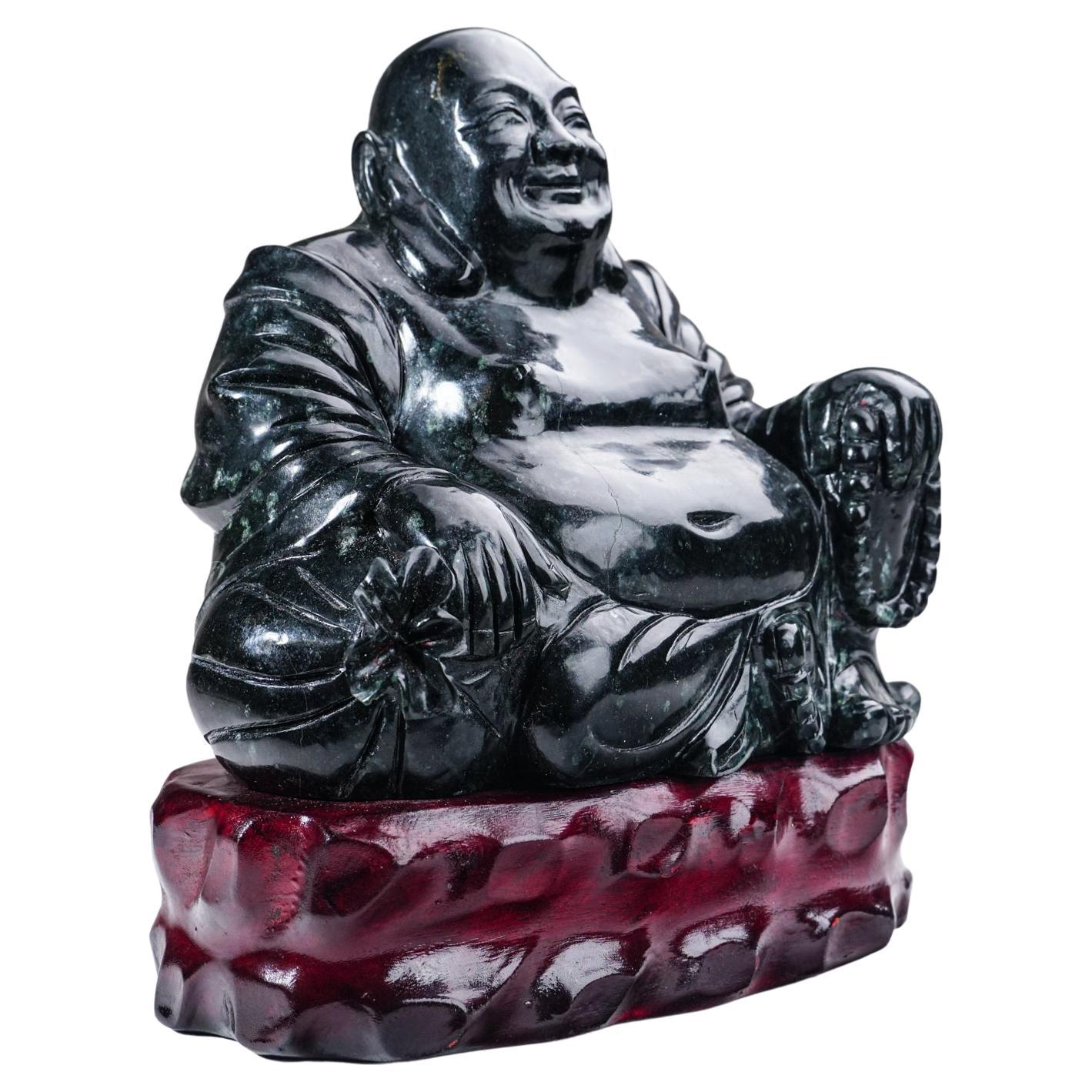 Large hand carving of Buddha on a wooden display stand. This piece is hand carved from a solid piece of Nephrite Jade that is hand polished to a mirrored finish. 

 

Weight: 7 lbs, Dimension: 7.5 x 4.5 x 8 inches.