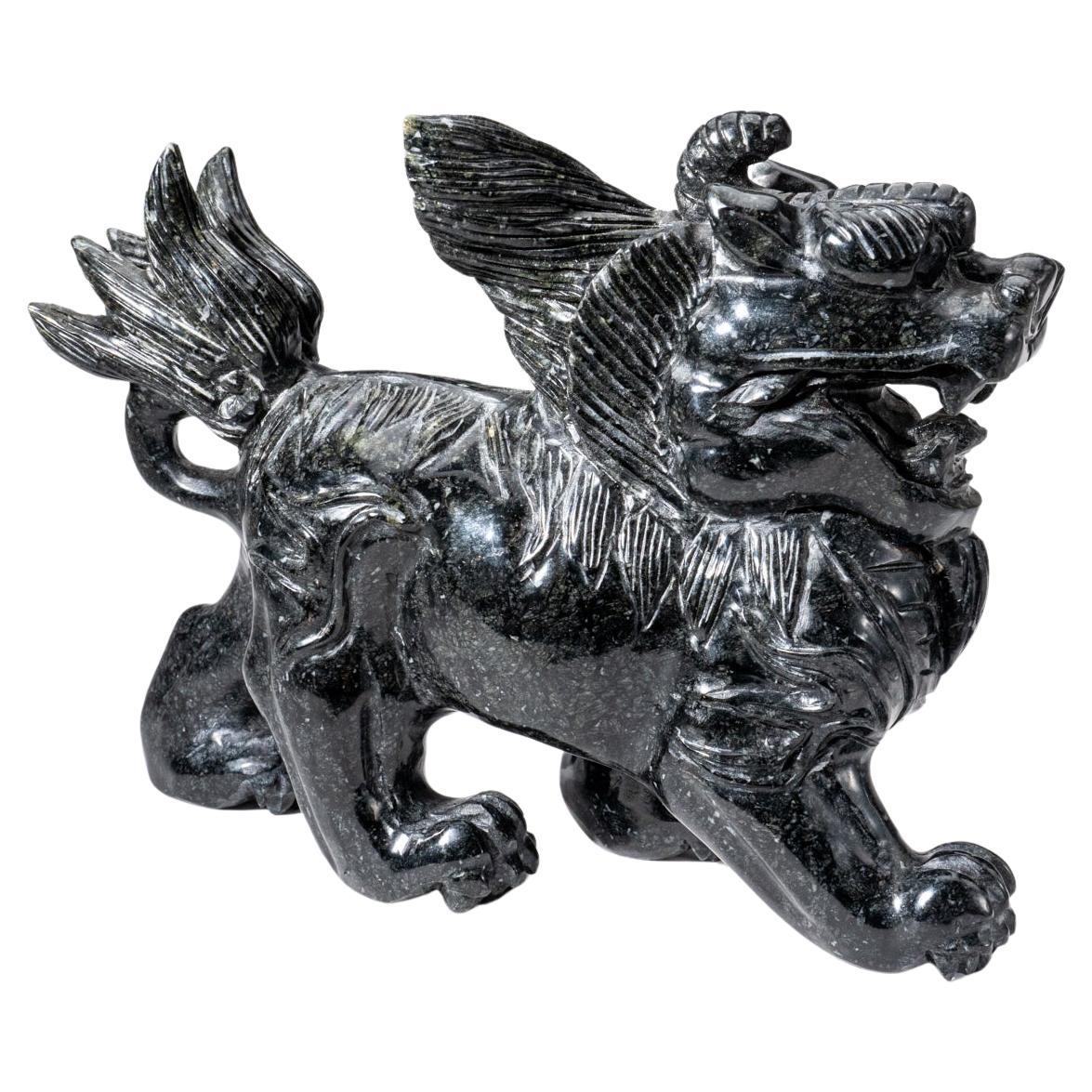 Large hand carving of Chinese Foo Dog. This piece is hand carved from a solid piece of Nephrite Jade that hand polished to a mirror finish. This jade is all natural, with a vibrant hunter green color. A perfect addition to any interior! Guardian