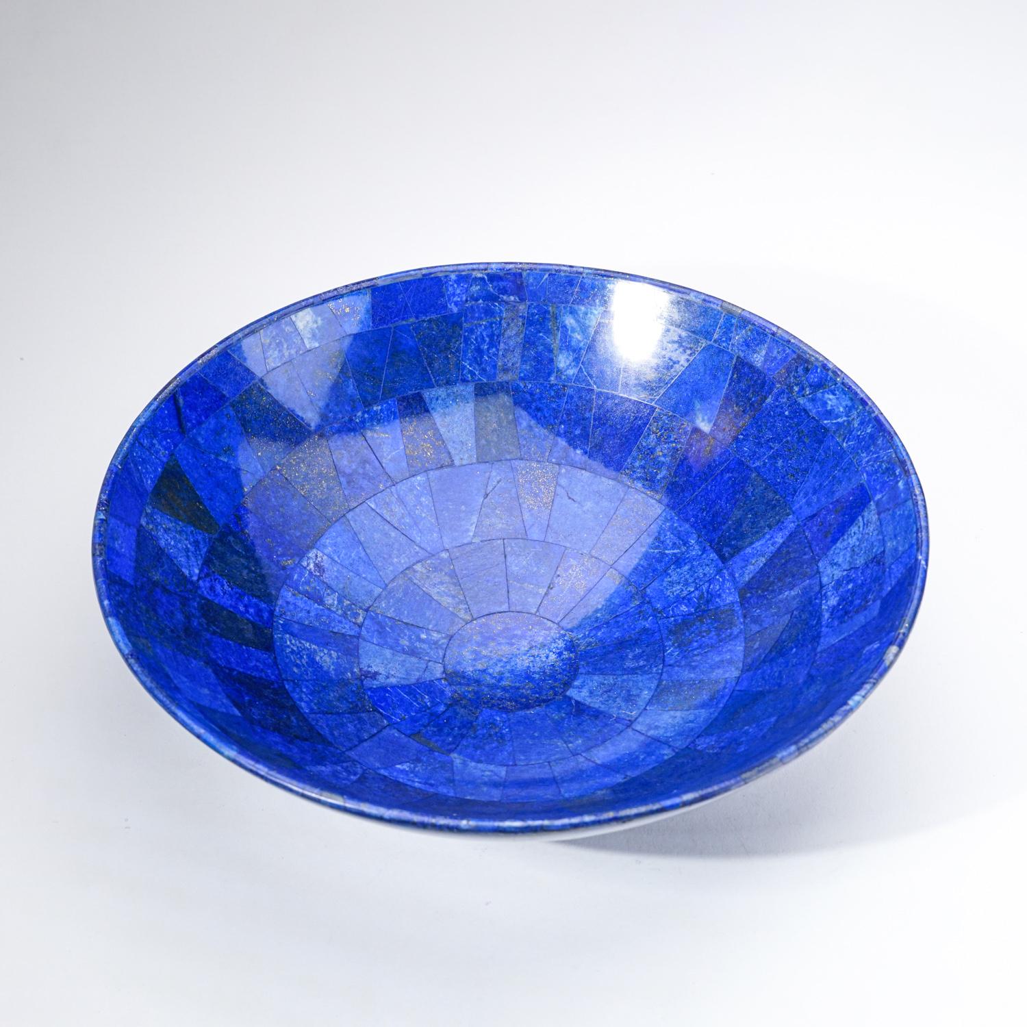 AAA quality hand-polished natural Lapis Lazuli bowl from Afghanistan.  This specimen has rich, electric-royal blue color enriched with scintillating pyrite microcrystals. This extra grade lapis bowl is a wonderful example and would make a lovely