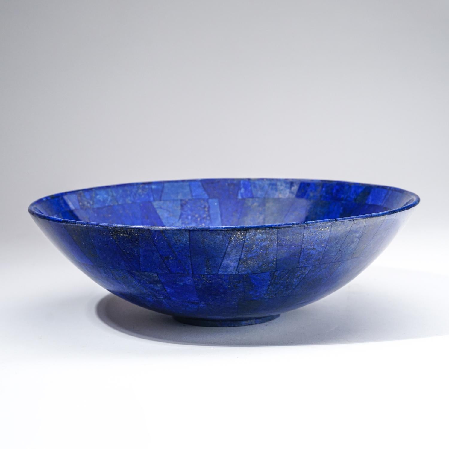 AAA quality hand-polished natural Lapis Lazuli bowl from Afghanistan.  This specimen has rich, electric-royal blue color enriched with scintillating pyrite microcrystals. This extra grade lapis bowl is a wonderful example and would make a lovely