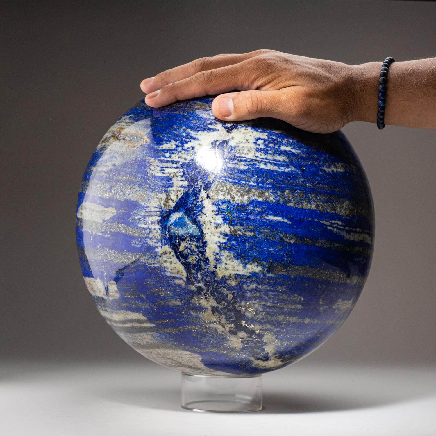 Museum quality, giant hand-polished natural Lapis Lazuli sphere from Afghanistan.  This specimen has rich, electric-royal blue color enriched with scintillating pyrite microcrystals.

Lapis Lazuli is a powerful crystal for activating the higher mind