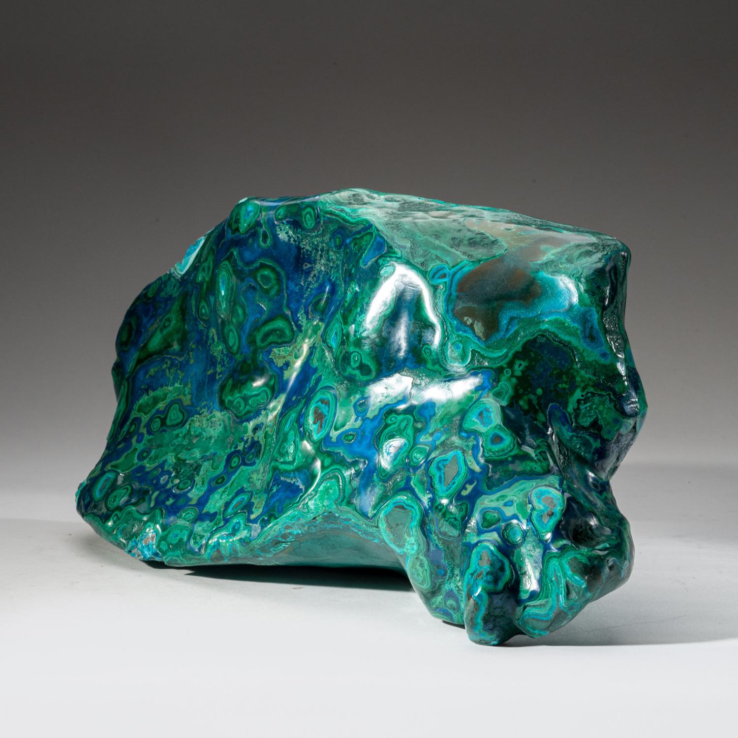 This large, museum-quality piece of freeform Bulls-eye Malachite with Blue Azurite, is hand-polished and sourced from Zaire. This collectors specimen is a rare combination of the two mineral types. This piece has well defined banded concentric
