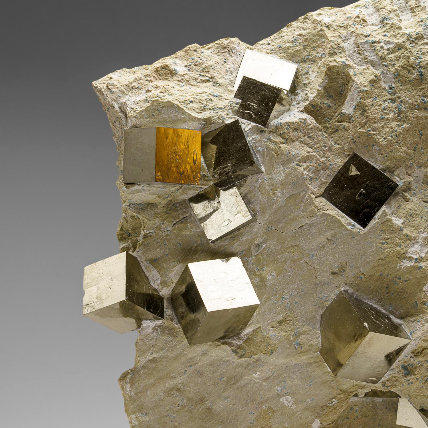 A world-class cluster of perfectly terminated cubic Pyrite crystals, interlocked on it's natural basalt matrix. This is an extremely large and unique piece - as less than a handful are found per year. This piece was discovered in Navajun, Spain -