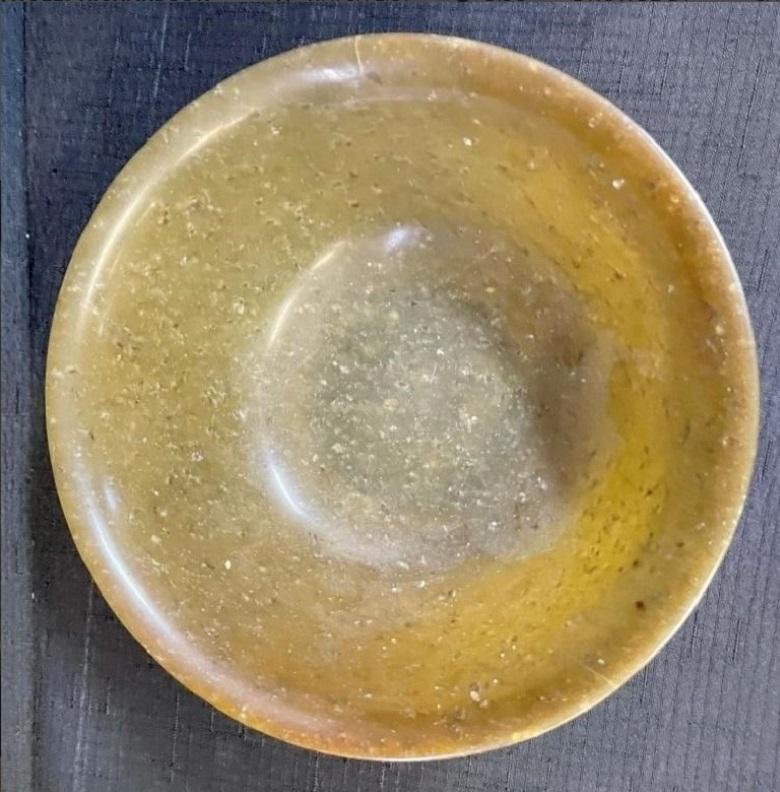 This genuine quartz aventurine bowl is easily incorporated into any decor or style and is suitable for tableware, a catch all, or display. This aventurine quartz bowl has a fairly uniform translucent, light olive yellow background with well
