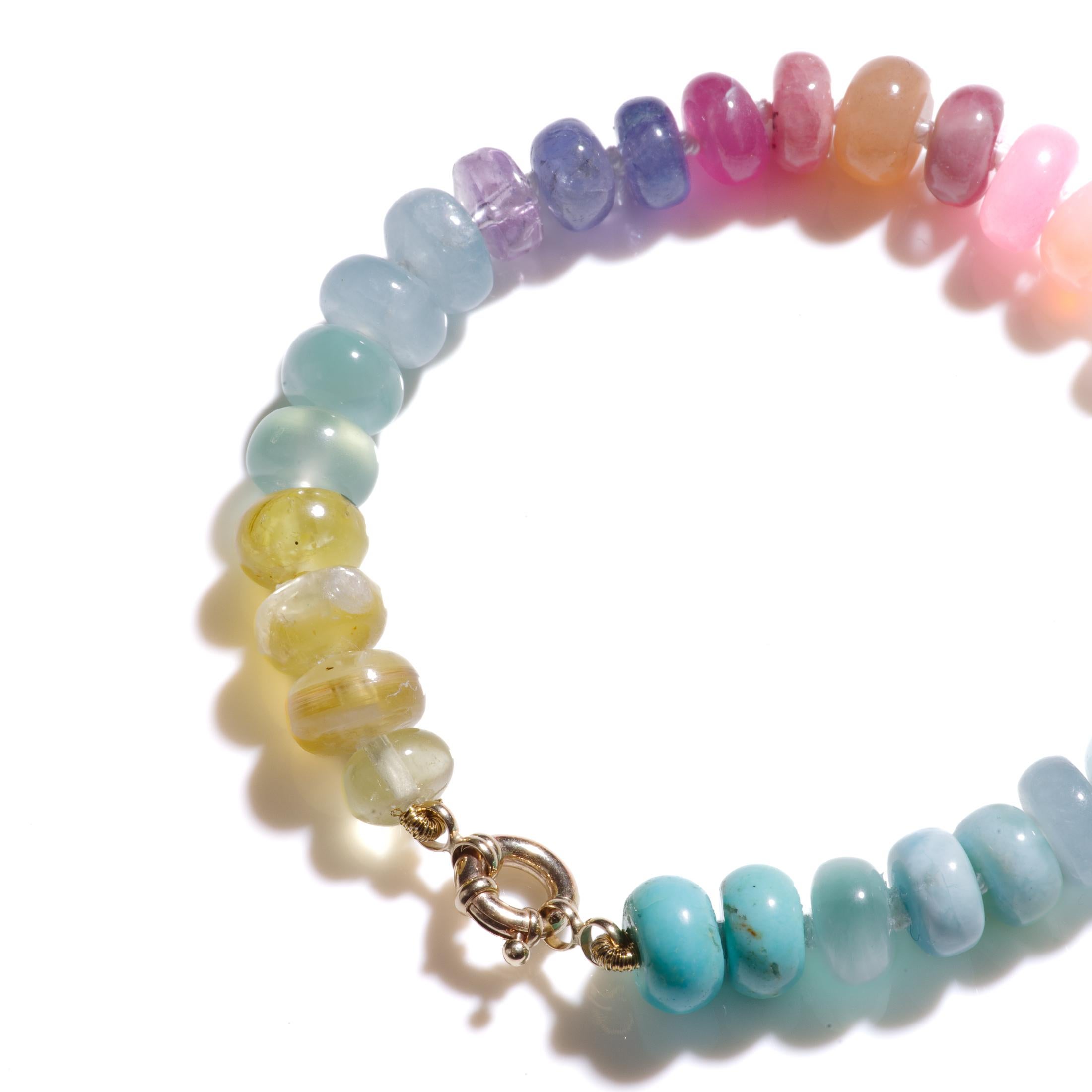 The perfect pastel rainbow gemstone bracelet, methiciously handknotted and finished with a gold clasp. A stunning bright colored mix of precious gemstones around your wrist! This beauty is made of  7-8mm polished gemstones such as;

• Rainbow