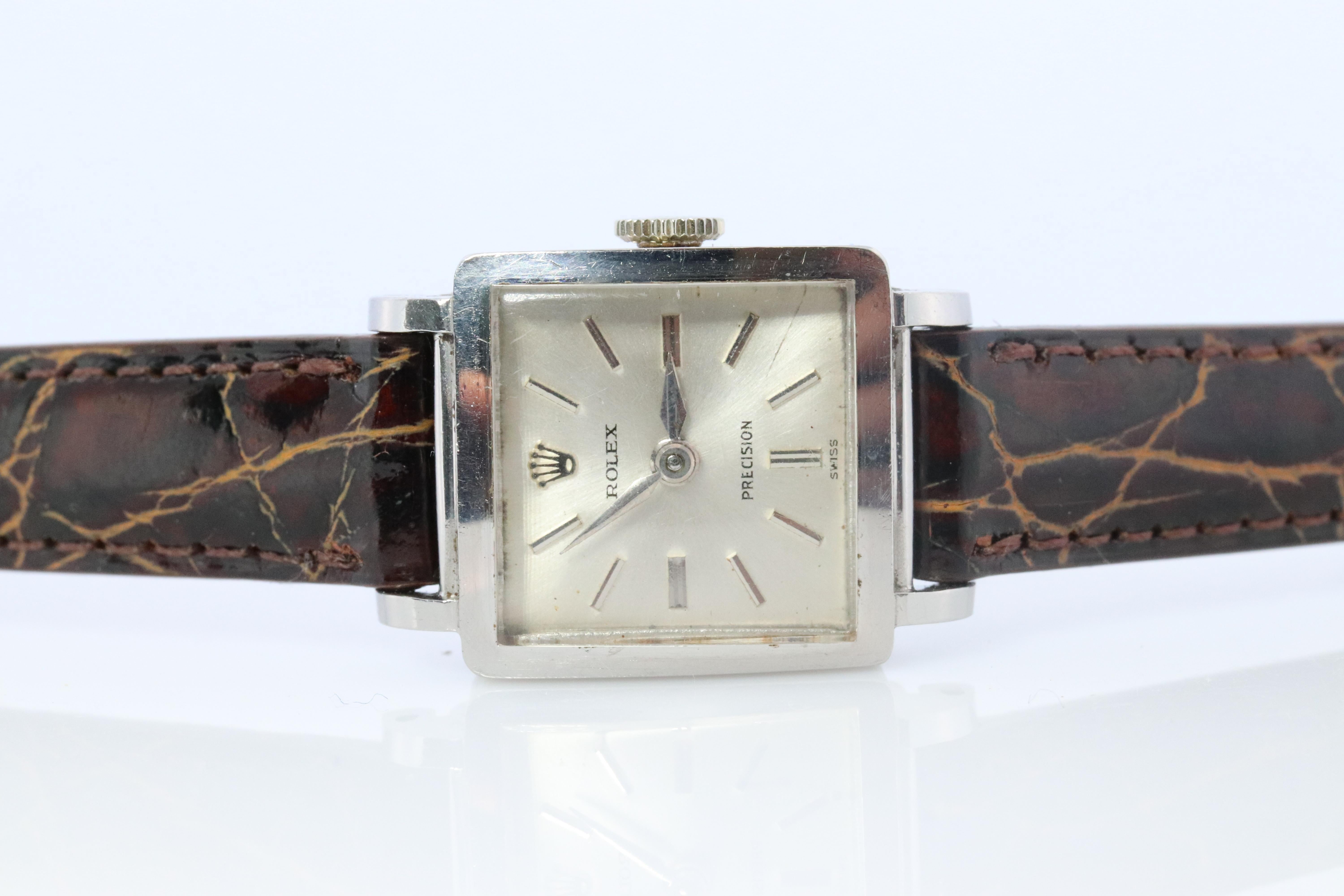Stainless Steel Rolex Precision Ladies mechanical Movement Wristwatch.

Just had a Full Service.
Rolex Movement Ref. 3458. Pre-Cellini Model

1960s Circa

Beautiful Watch. Manual Windup mechanism. 

Case is Stainless Steel
New Brown Leather