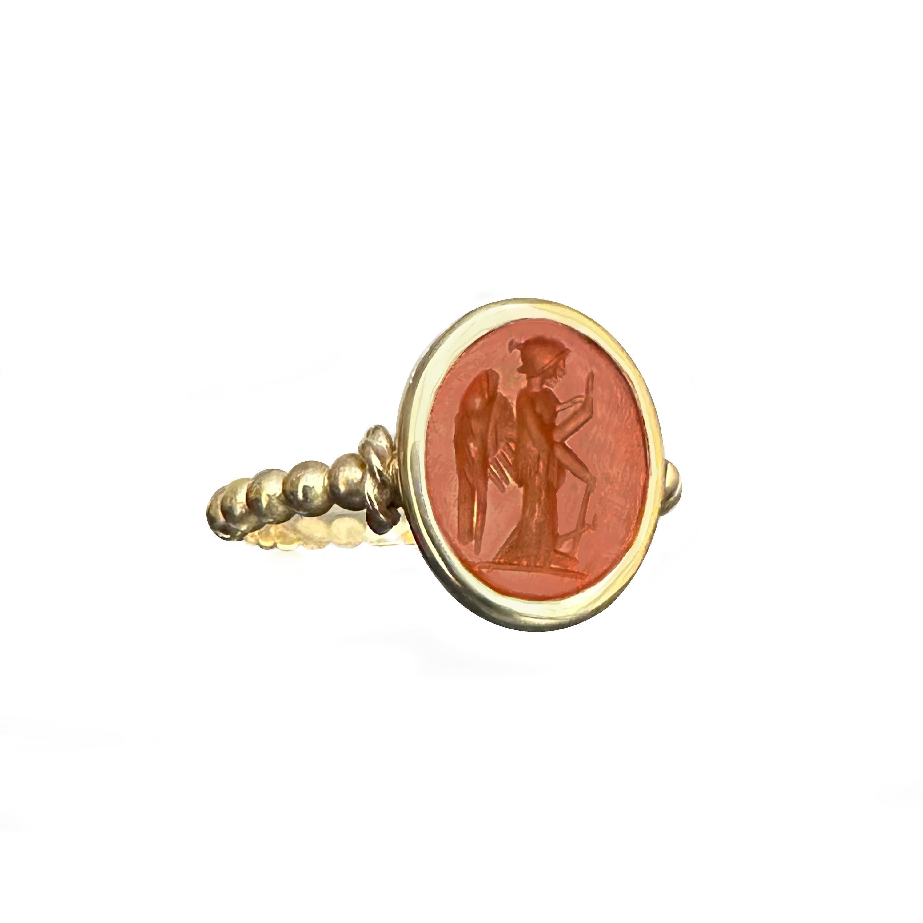 Crafted with precision in 18 kt gold by our skilled artisans, this captivating ring features an ancient Roman carnelian intaglio, a relic dating back to the 1st-2nd century AD.

Engraved within is the resplendent Goddess Athena, donning her