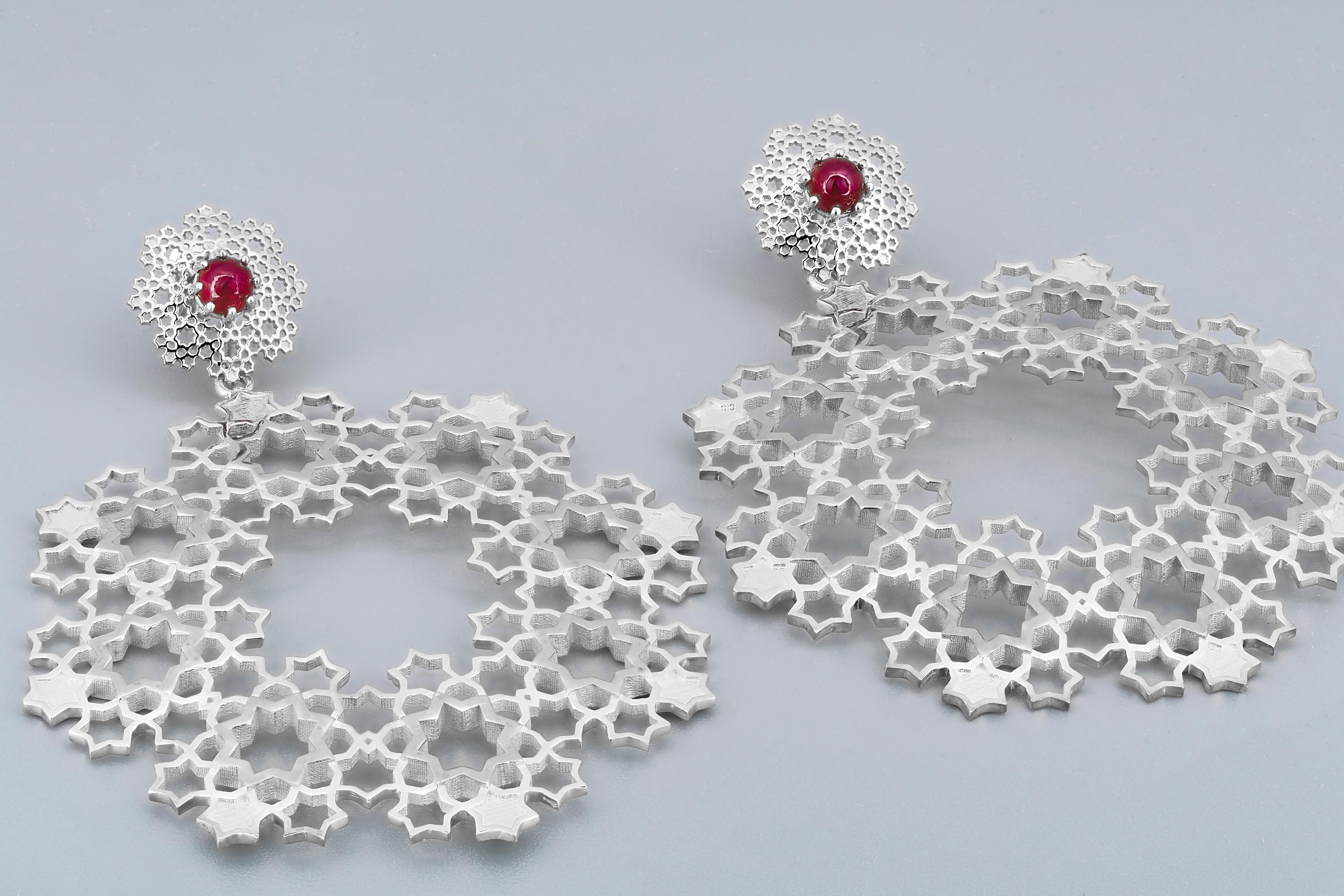 Genuine rubies earrings. Natural ruby earrings. Different type wearring massive earrings with rubies - lower part removable.

Made of 925 silver  

You can wear earring in different ways: as studs (for everyday wearring) and as a massive earrings.