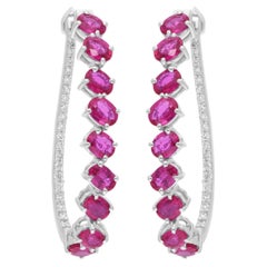 Boucles d'oreilles en or blanc massif 14k avec rubis véritable et diamant.