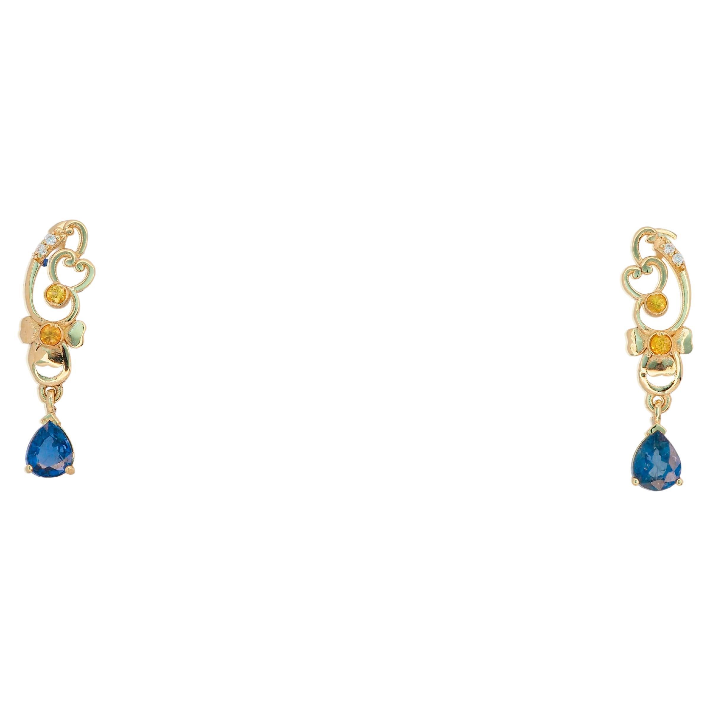 Genuine sapphire earrings studs in 14 kt solid gold. 
Pear sapphire drop earrings. Blue sapphire studs. Statement earrings.

Metal: 14k gold , no hallmark tested in lab.
Weight: 2.3 gr.
Size: 22.5x6mm.

Set with:
Sapphires: blue color, pear cut,