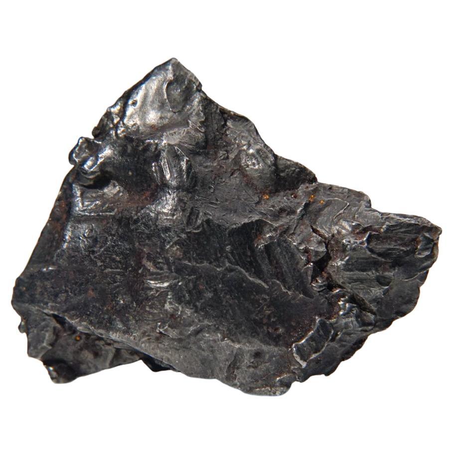 Genuine Sikhote-Alin Meteorite on Acrylic Stand (87.7 grams) For Sale