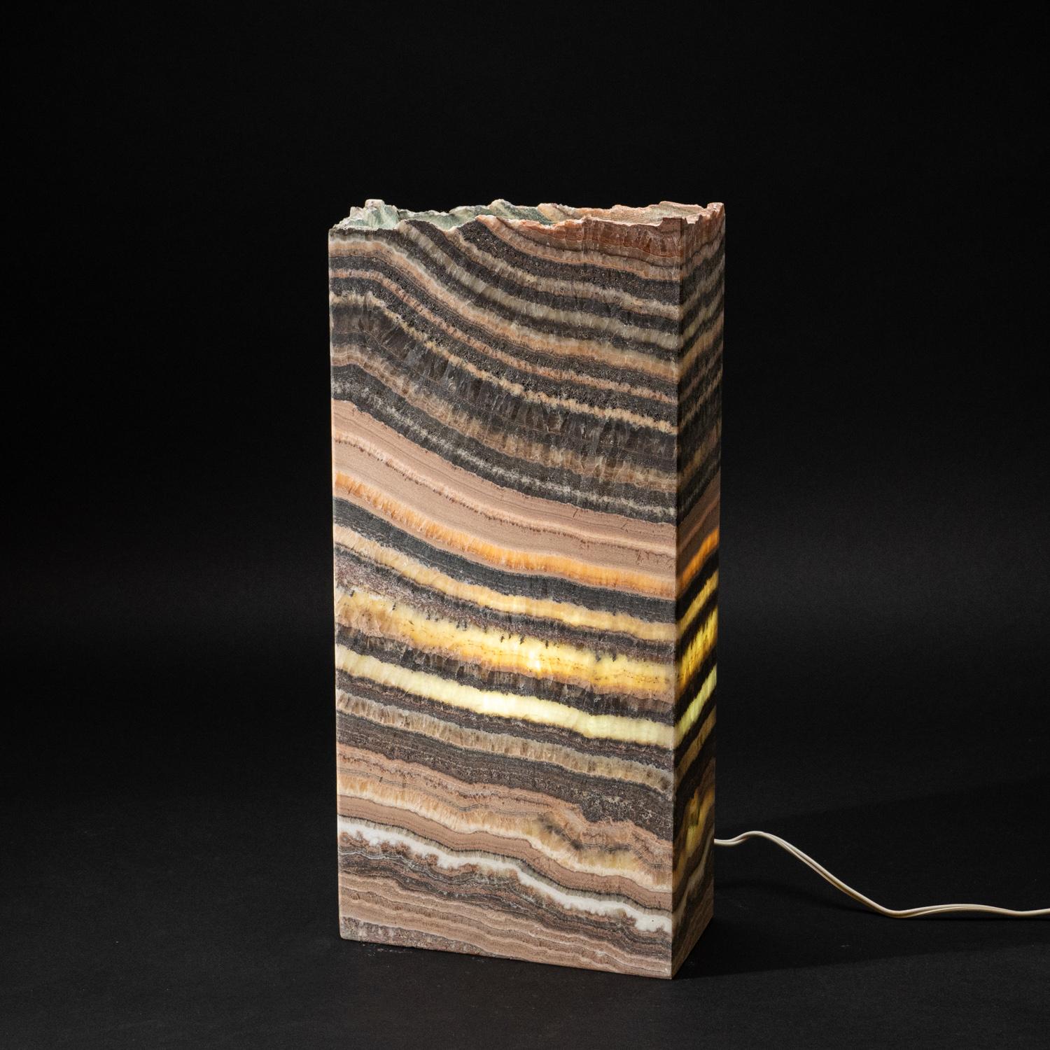 Medium square lamp composed of Natural banded Mexican onyx. This beautiful lamp is crafted from natural onyx with sophisticated appeal.  lamp will look great in your home as a perfect accent to lighting in various rooms.

In crystal healing, Banded