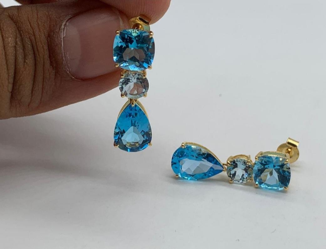 Elegant 14k White Gold earring studded with Swiss Blue Topaz & Diamonds. Earring is out solid gold and can be customized in Yellow & Pink Gold.

Swiss Blue Topaz are Clean, Transparent & Nicely Cut. Diamonds are color and Vs purity. They are clean