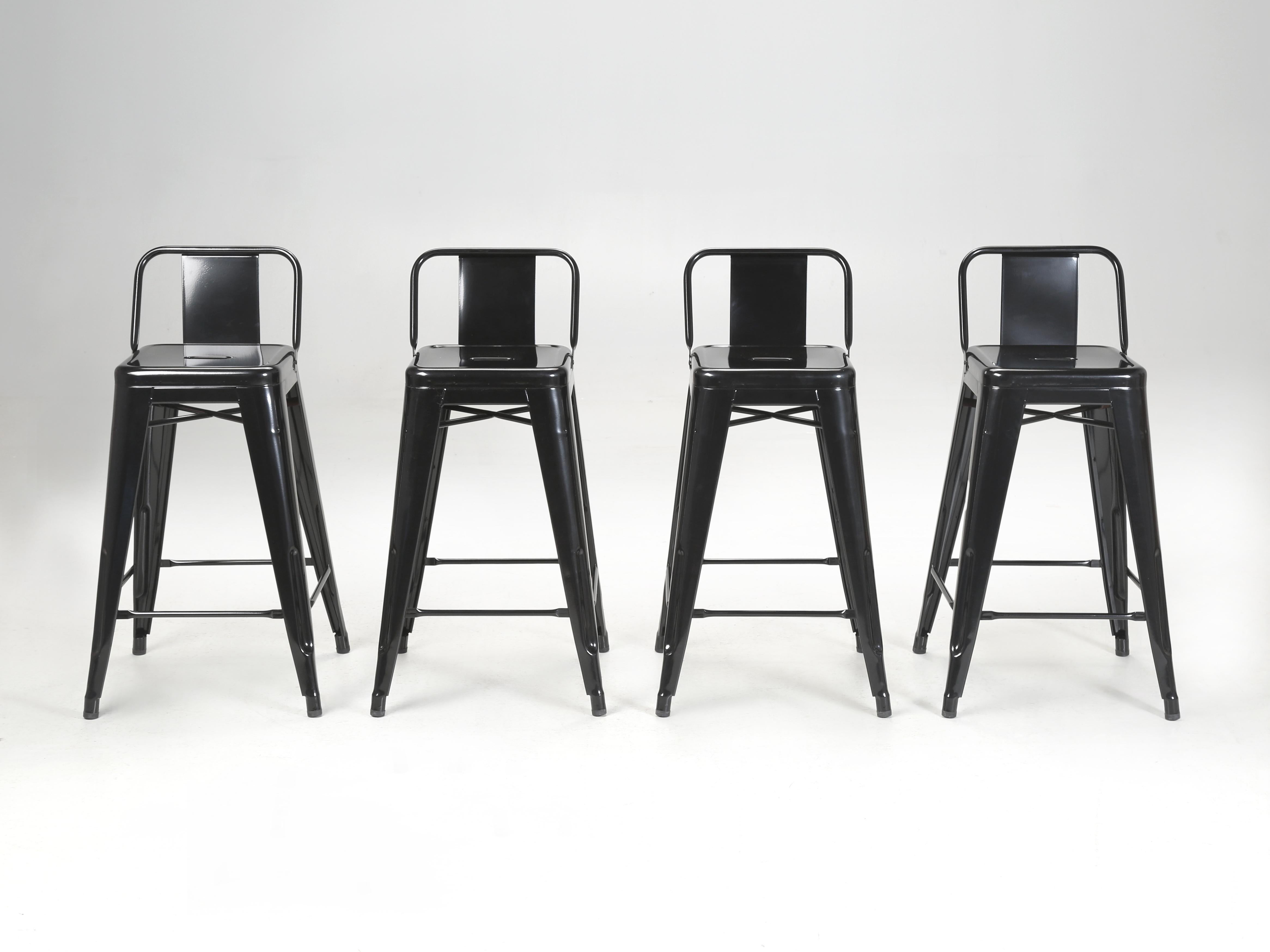 Genuine Tolix Low-Back Counter Height Stools Made in France found stored in a warehouse for many years. Basically new, although they may have a few surface scuffs from the long term storage. Currently, there are a few more available in black and