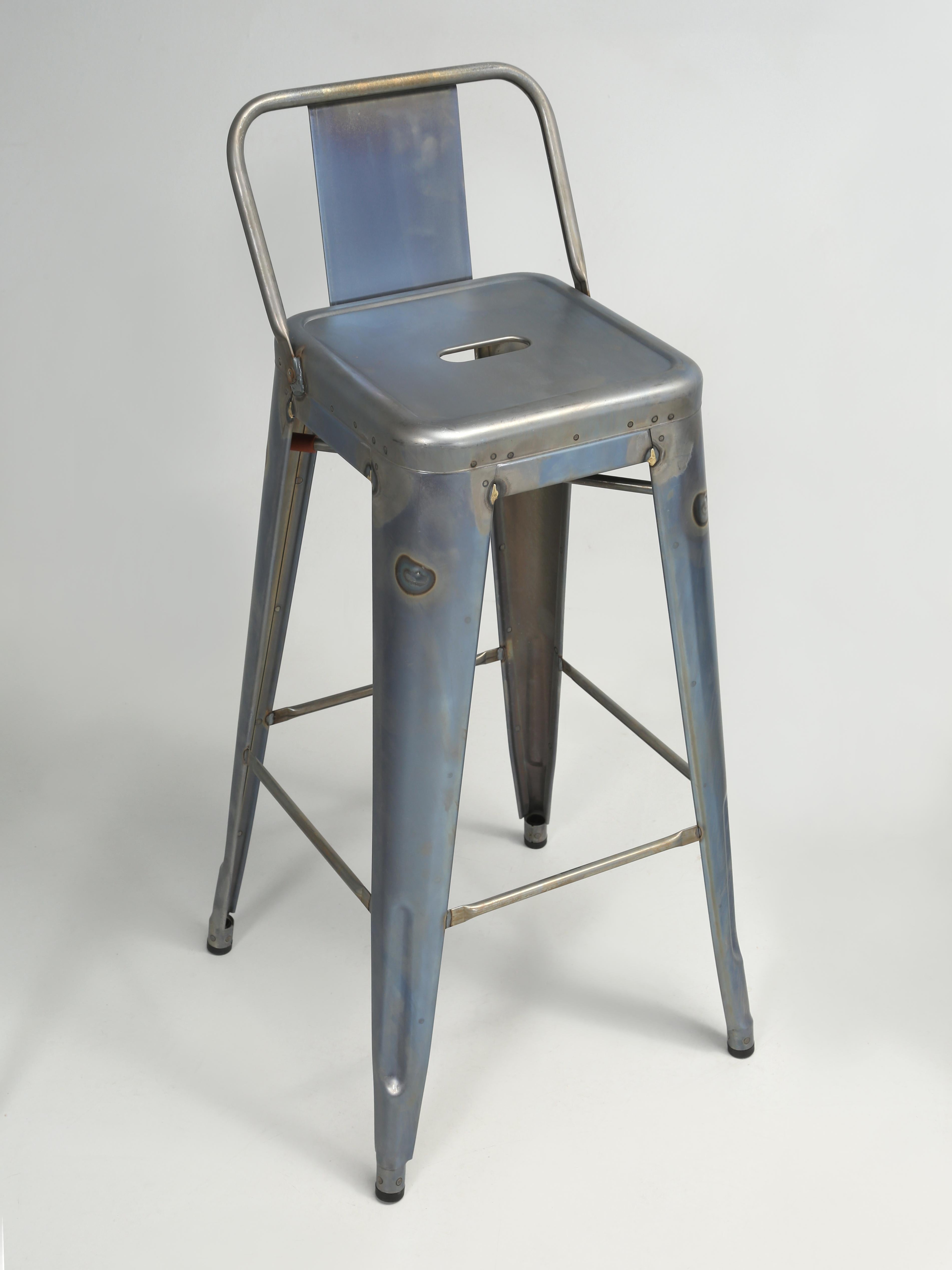 Genuine French Hand-Made Tolix Steel Bar Stools, not to be confused with kitchen island stools which are lower. Our set of (4) Bar Height Tolix Steel Stools are finished in a blue wash that prevents rust from forming and are ready to paint. We