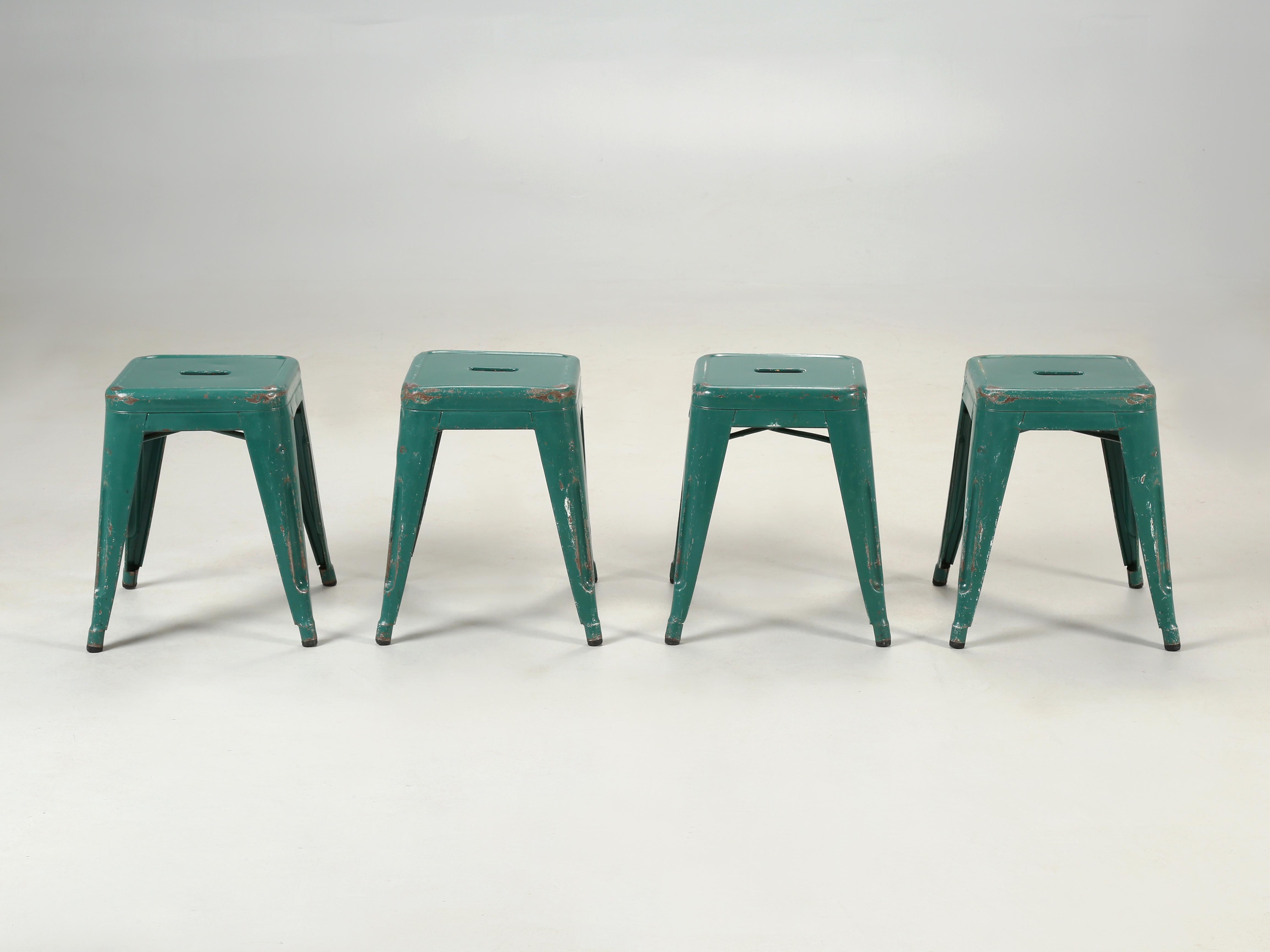 Vintage French Tolix steel stacking stools in a medium to dark green, with a great natural patina. We are thinking these Tolix stools are from the 1960's, however with a steel stool, it's almost impossible to select an accurate date. The paint is