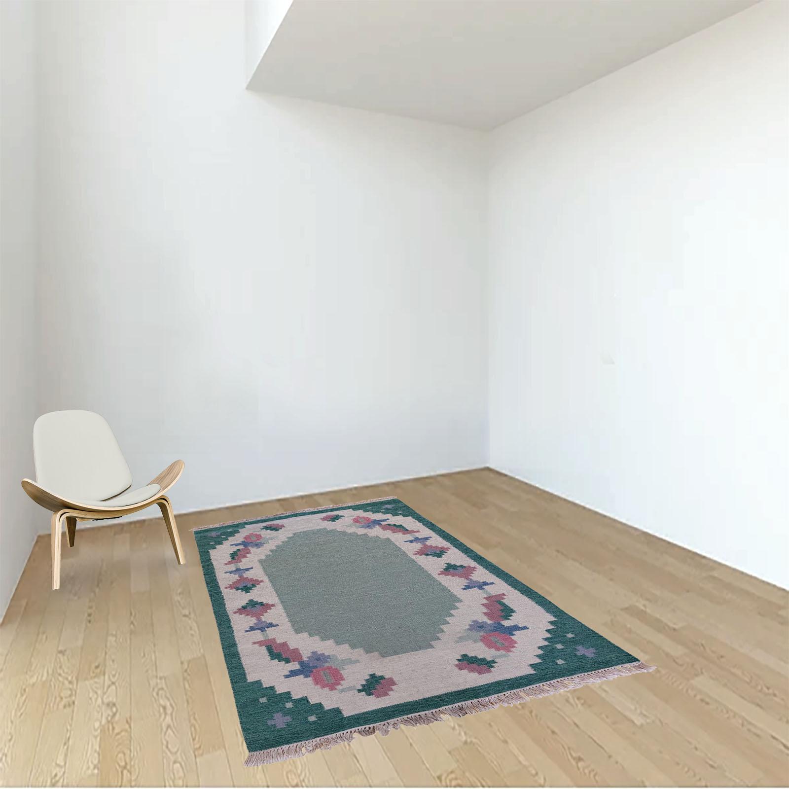 Genuine vintage Scandinavian Kilim rug. It has a stylized floral design with an empty center, suitable for placing under a coffee table.
The color palette comprises gentle shades of teal, green, pink, and blue. It is an elegant and attractive