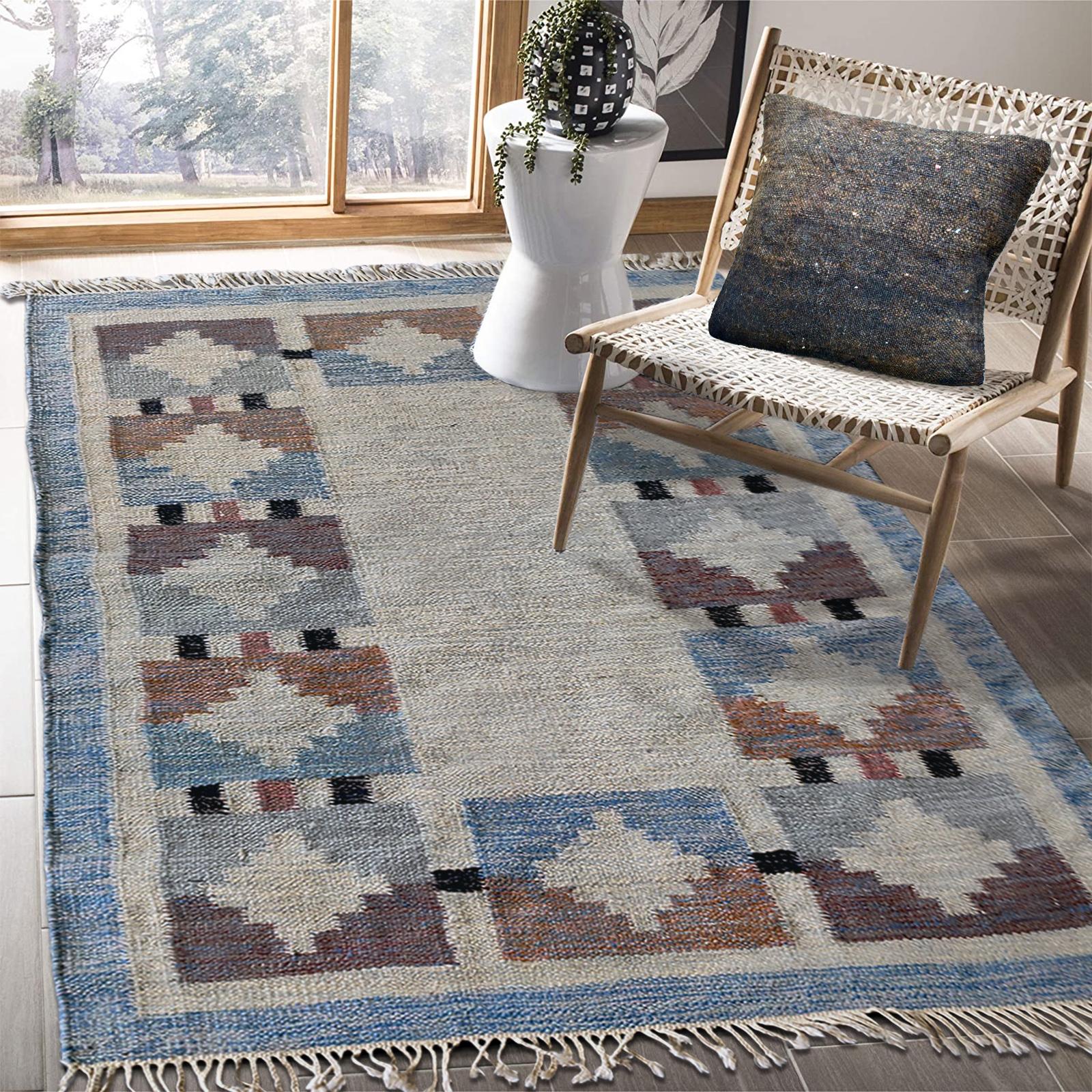 Genuine Vintage Scandinavian Kilim rug, design attributed to Karin Jönsson. 
The color palette comprises of gentle shades of beige, brown and grey, with black and rust pink accents, against a neutral beige background, with faded blue border, in