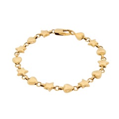 Véritable bracelet vintage Tiffany & Co. en or jaune 18 carats 750 Coeurs étoiles