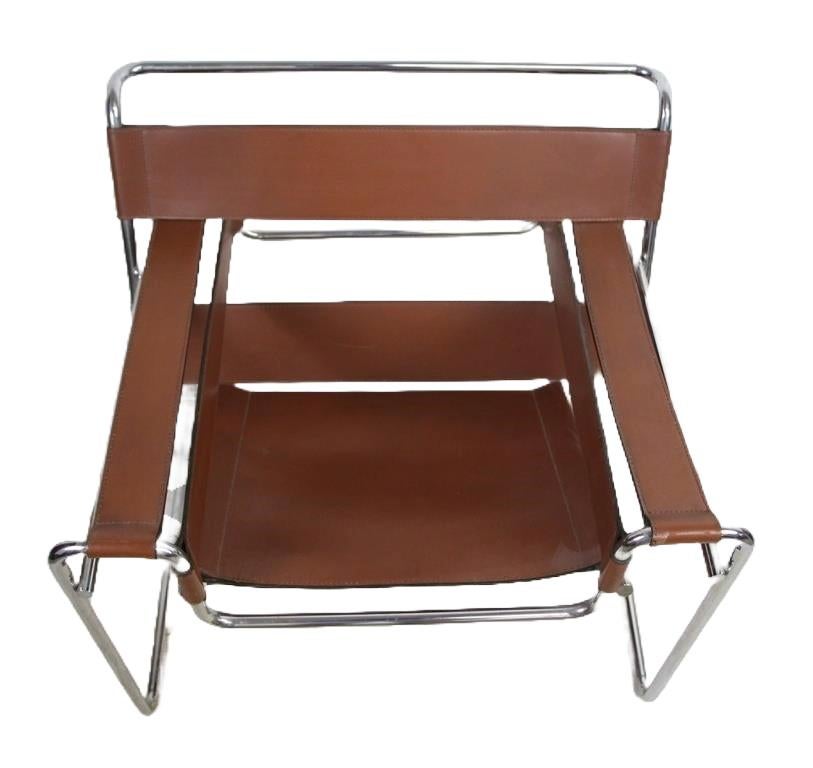 Presenting an iconic  Wassily chair by Marcel Breuer, upholstered in soft brown leather. This authentic Wassily chair, designed in the 1920s for Knoll, is celebrated as a landmark in modern design, embodying the Bauhaus movement's innovative spirit.