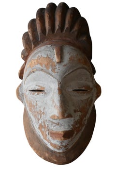 Genuine wooden mask from the Punu tribe, Gabon , first half 20th century