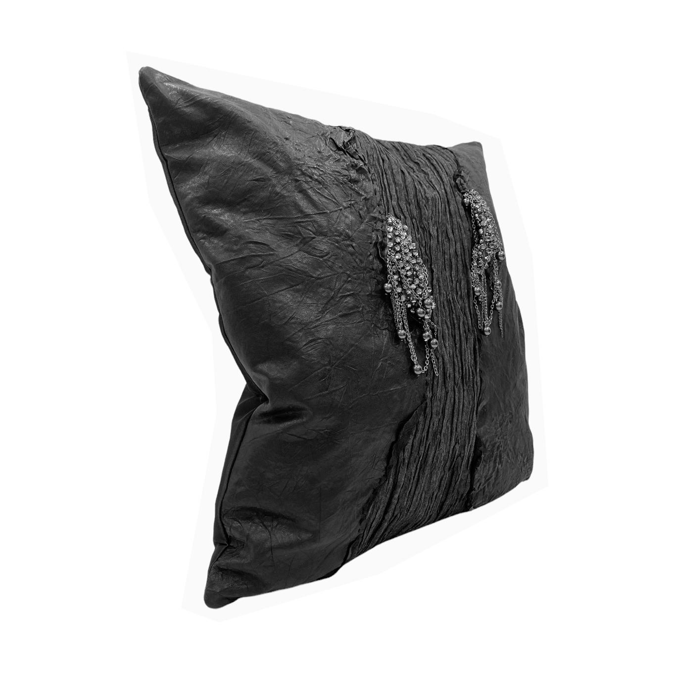 Authentic Italian wrinkled black leather pillow with hand-sewn crystals and sixteen real black.
pearls. This gives a perfect softness and sheen to the pillows, complementing any interior decorations These pillows were dreamt up by our in-house