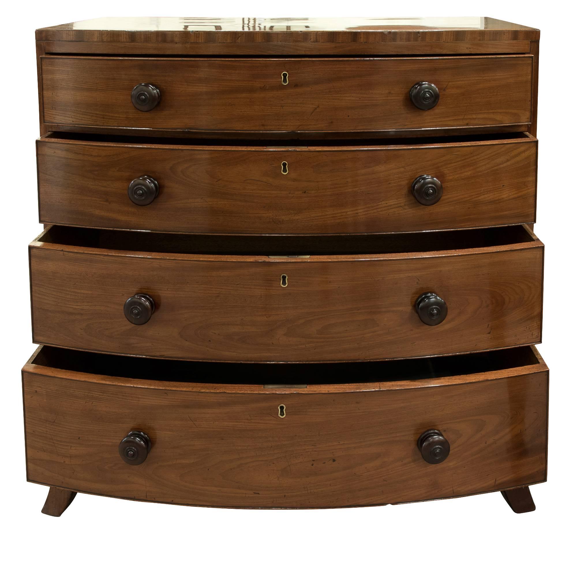 George III faded mahogany flush top bow fronted chest of 4 graduated drawers standing on splayed feet.

circa 1800.
 