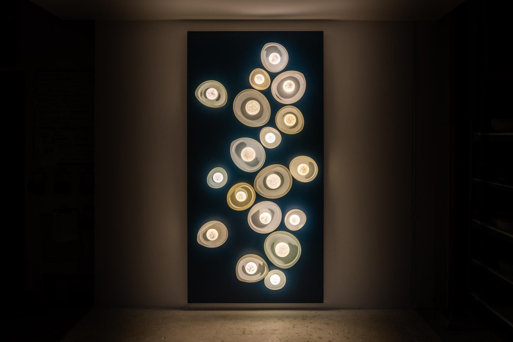 Geo Petra Wall Light Installation by The GoodMan Studio
Dimensions (May vary):
Small ⌀ 15 x H 6 cm / ⌀ 21 x H 6 cm
Medium ⌀ 23 x H 6 cm / ⌀ 28 x H 6 cm
Large ⌀ 31 x H 6 cm / ⌀ 36 x H 6 cm
Materials: Glass, Metal and Silver Leaf

Hand blown glass