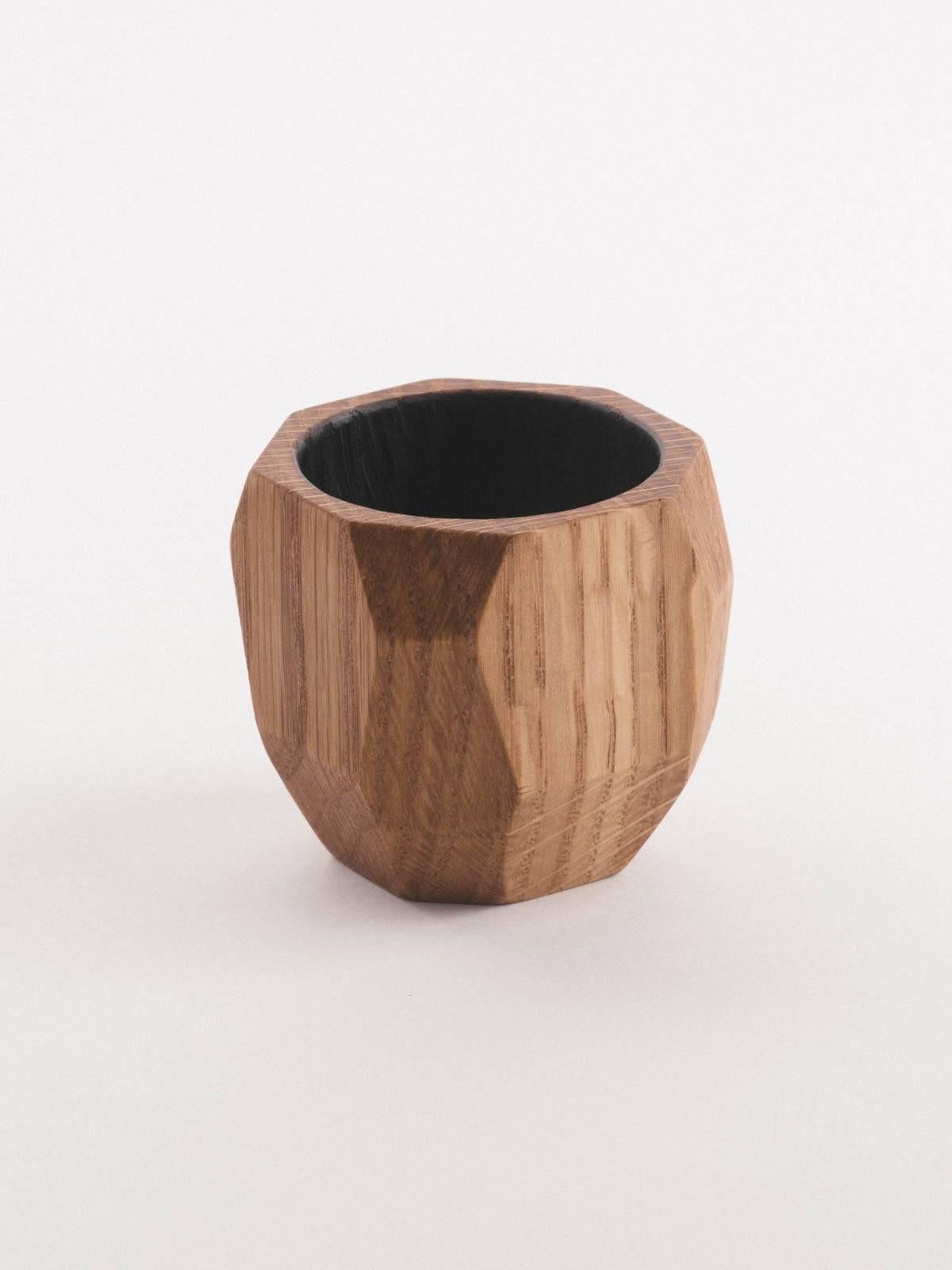 Both playful and graceful, each shape is milled, cut, and turned by hand. Each cup features a charred and polished interior. This charring harkens towards both Japanese 'shou sugi ban' techniques as well as the time-honored tradition of distilleries