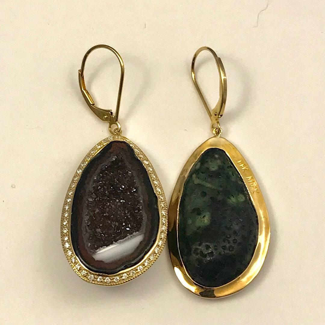 Geode Drop Earrings Set in 14K Yellow Gold with .75 Carats Total of Diamonds.
These earrings are set in 14k yellow Gold with .75 ct Total Weight of Diamonds surrounding the outside of these dark purple tone Geodes.

Comes in a cherrywood box.