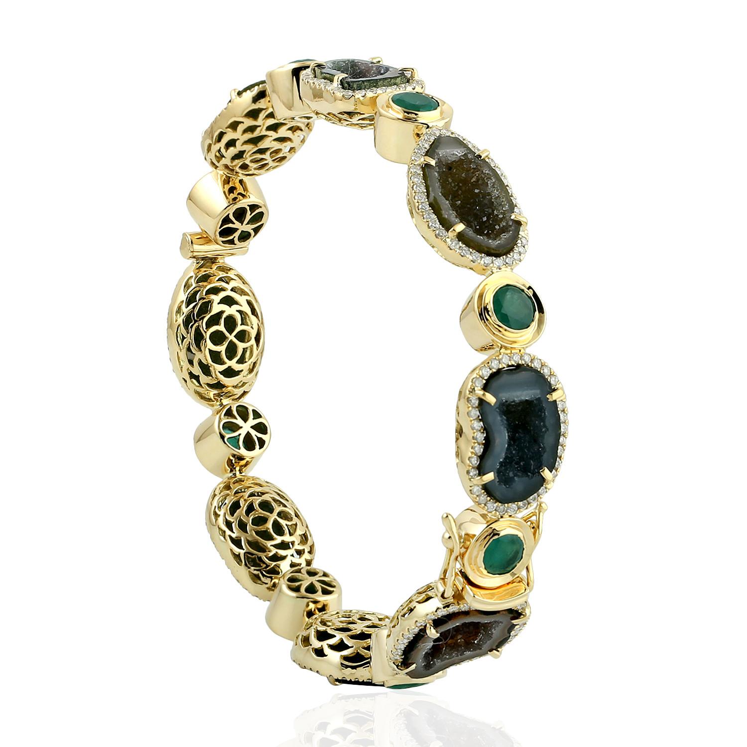 A stunning bracelet handmade in 18K gold. It is set in natural geodes, 3.63 carats emerald and 1.61 carats of glimmering diamonds. Clasp Closure

FOLLOW  MEGHNA JEWELS storefront to view the latest collection & exclusive pieces.  Meghna Jewels is