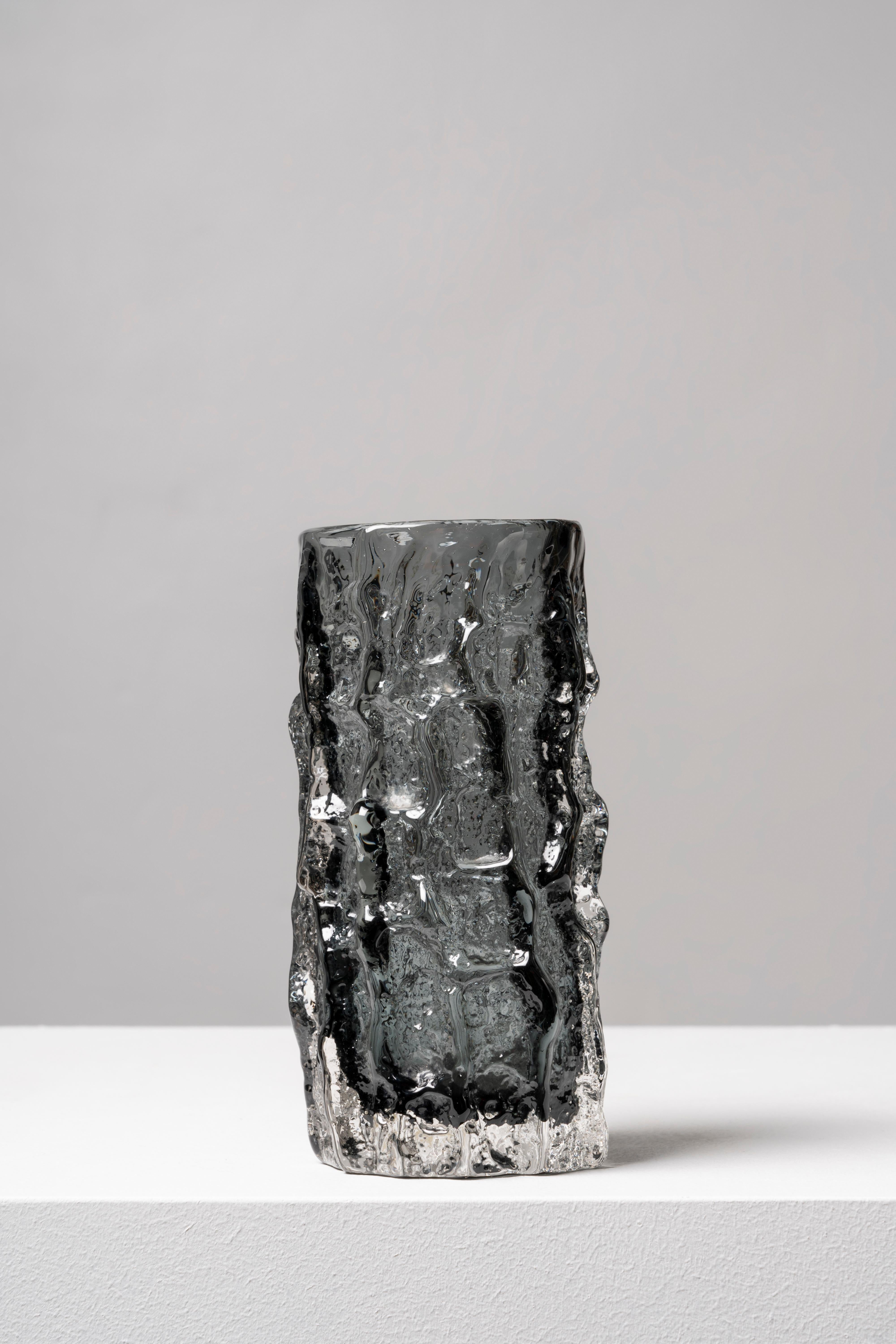 The design of this piece was the brainchild of Geoffrey Baxter, who joined Whitefriars in 1954, bringing a renewed air to the firm and creating a successful range of textured glass in 1967. The Bark model is one of the earliest examples of the