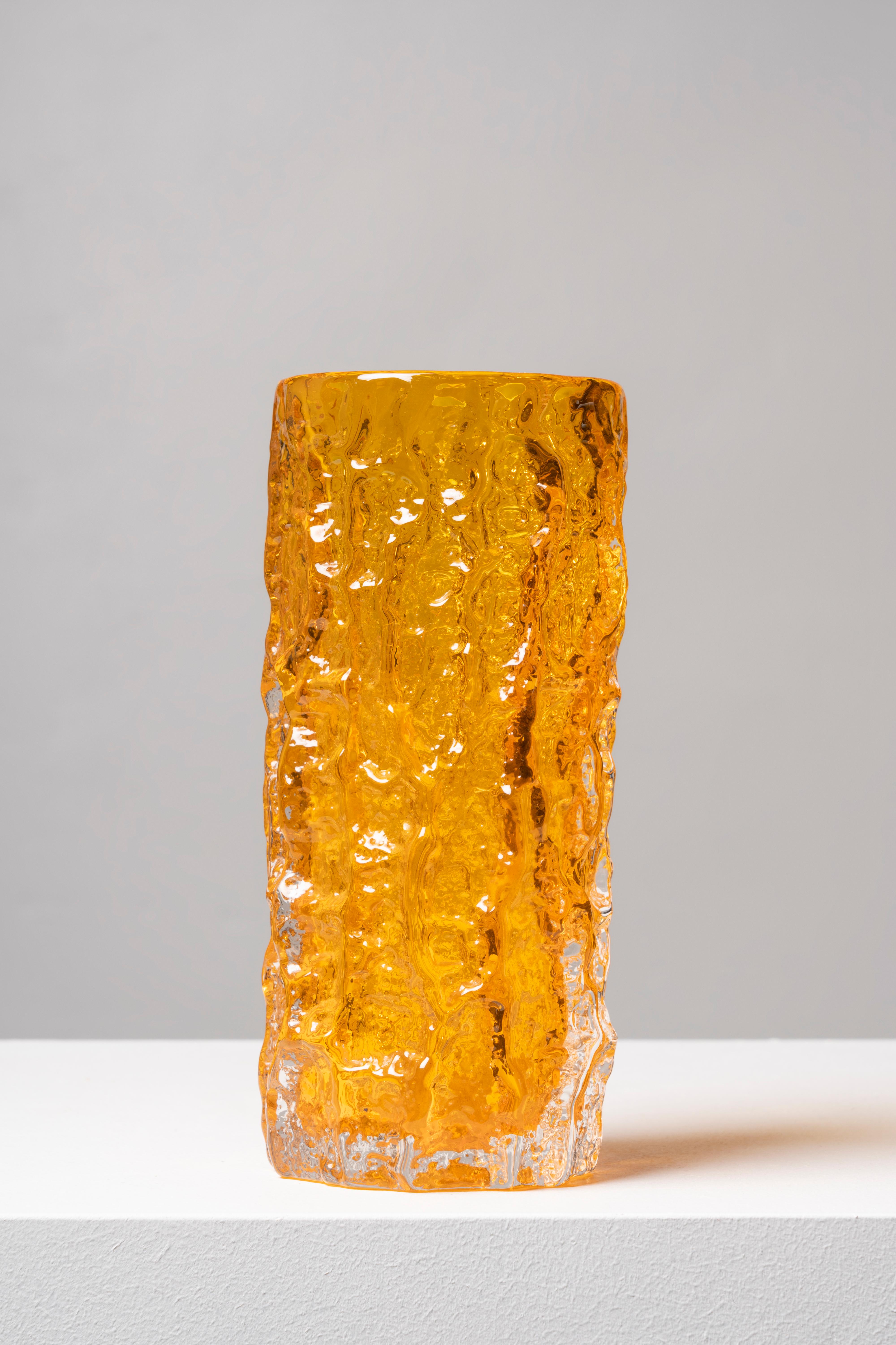 Orange textured glass vase. The design of this piece was the brainchild of Geoffrey Baxter, who joined Whitefriars in 1954, bringing a renewed air to the firm and creating a successful range of textured glass in 1967. The Bark model is one of the