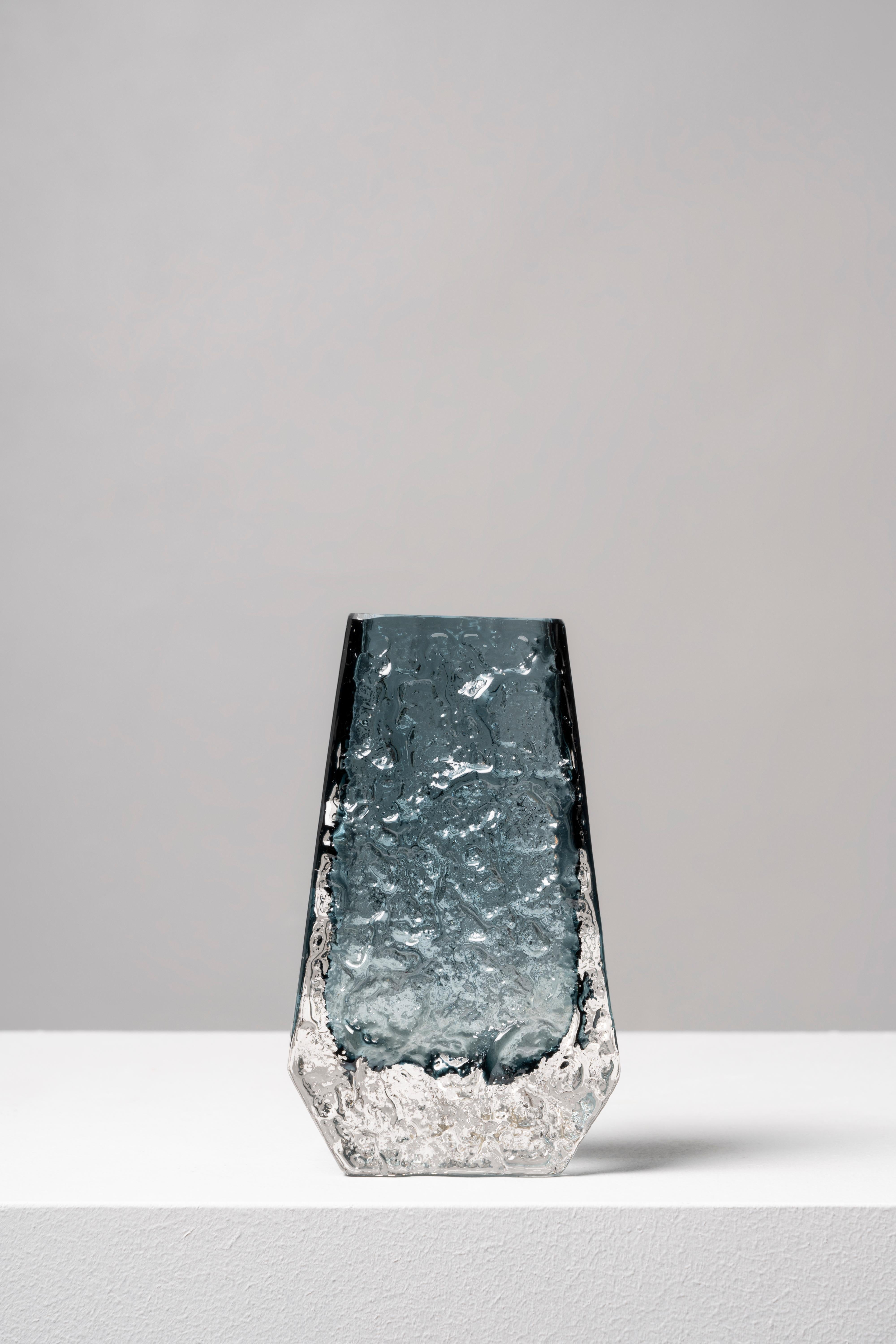 The design of this piece was the brainchild of Geoffrey Baxter, who joined Whitefriars in 1954, bringing a renewed air to the firm and creating a successful range of textured glass in 1967. The Bark model is one of the earliest examples of the