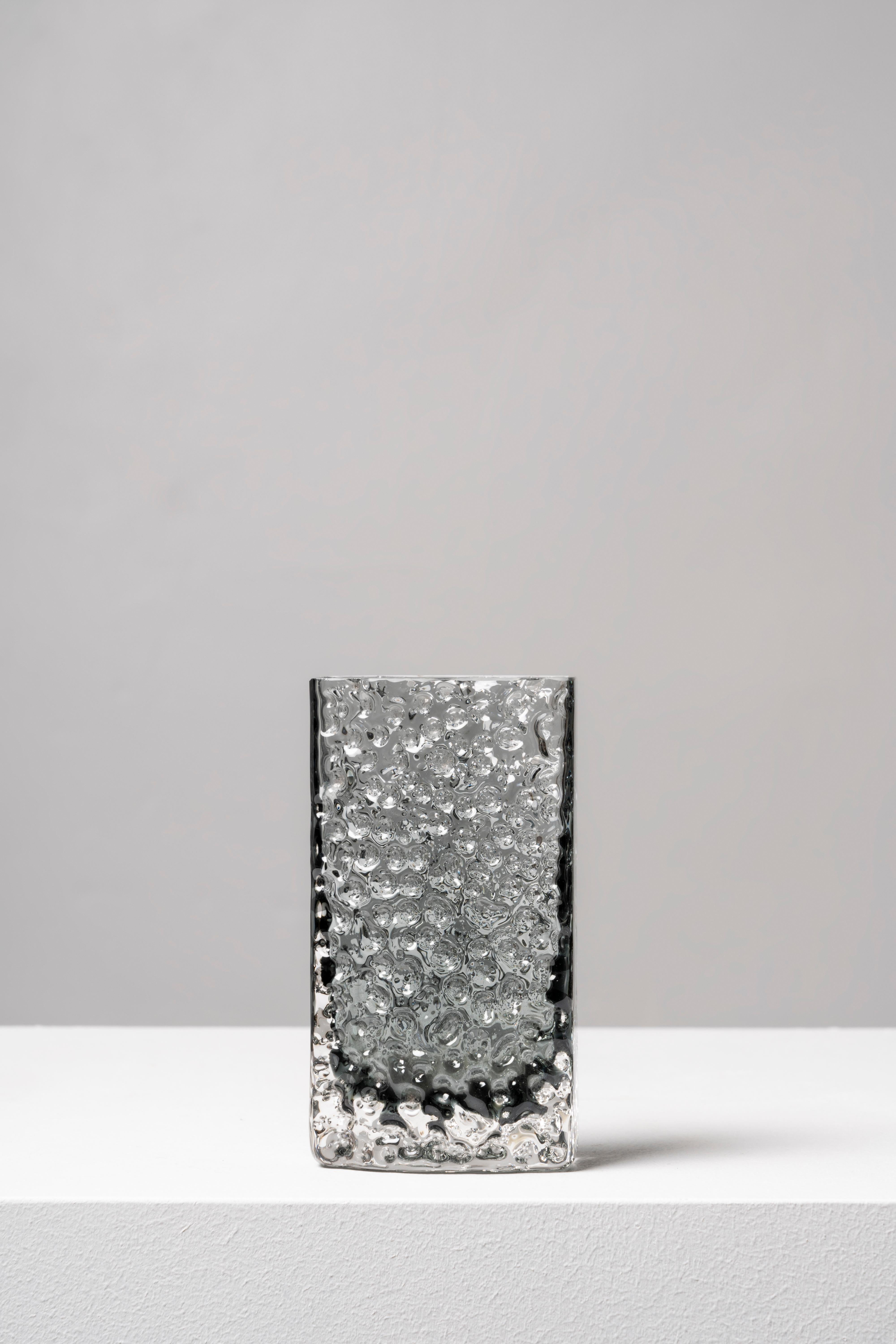 The design of this piece was the brainchild of Geoffrey Baxter, who joined Whitefriars in 1954, bringing a renewed air to the firm and creating a successful range of textured glass in 1967. The Bark model is one of the earliest examples of the