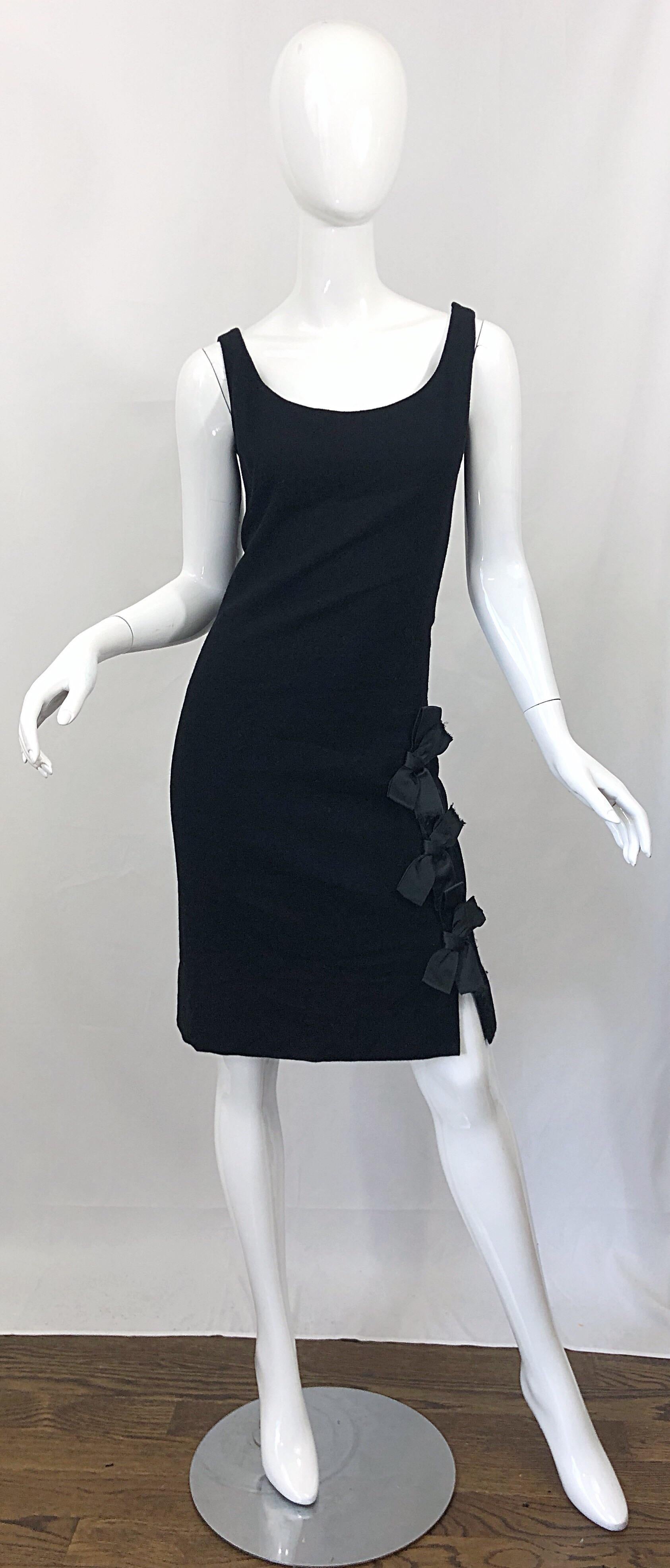 Timeless stylish 1960s GEOFFREY BEENE 60s vintage black wool bow detail sheath dress! Flattering sheath silhouette that looks great on any shape. Three black silk bows up the left hem. Hidden metal zipper up the side with hook-and-eye closure. Fully