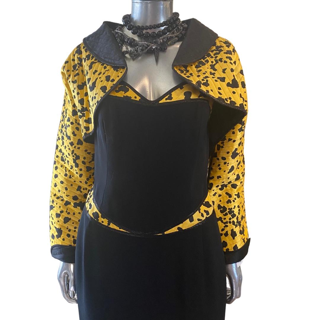 It is very hard to find a ensemble by legendary American designer Geoffrey Beene in this condition and  of this high end quality. It has everything that Mr. Beene was known for. The print and mix with black silk, the European metallic trim, the