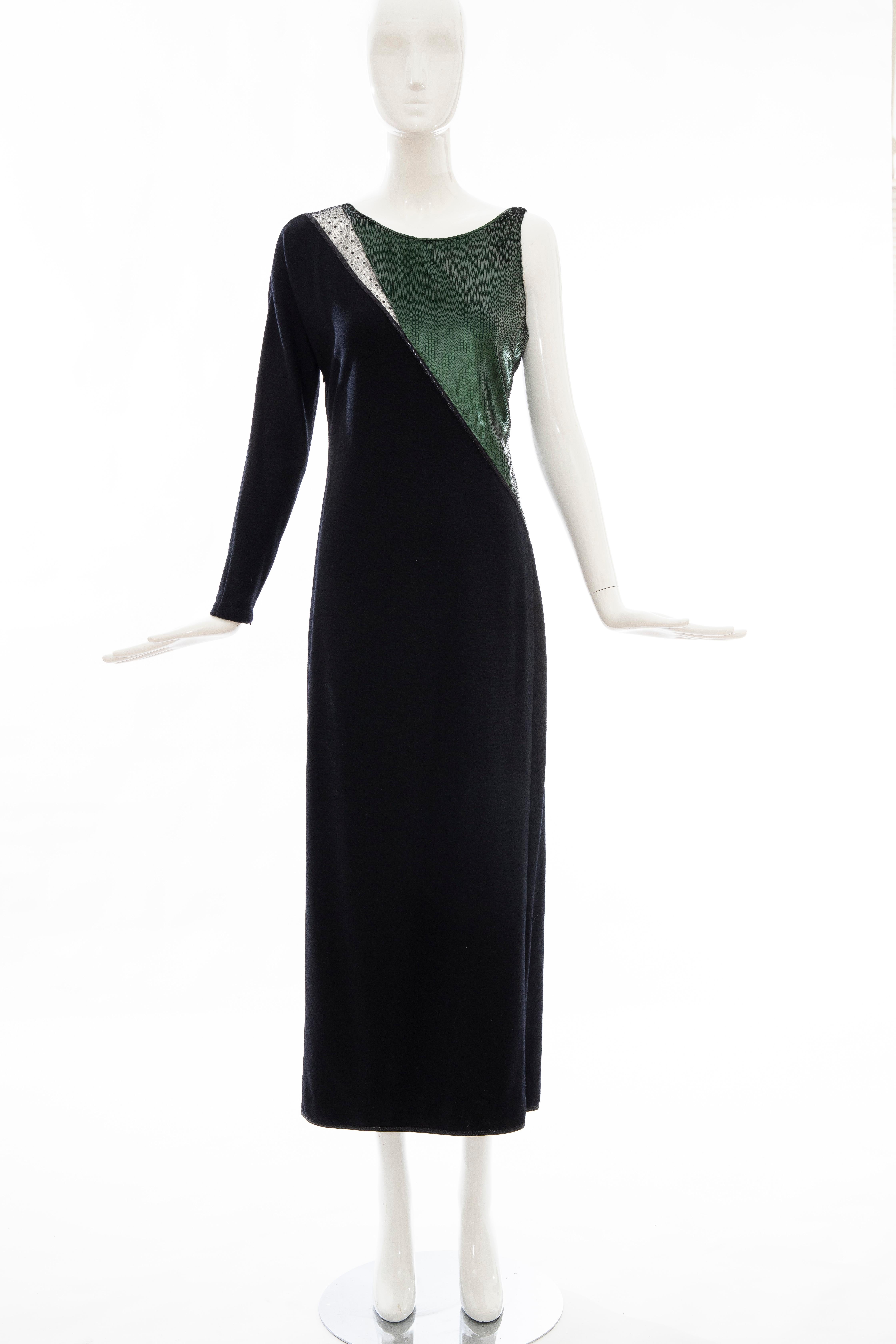 Geoffrey Beene, Fall 1991 black wool jersey evening dress, embroidered deep forest green sequins with point d' esprit lace inset, black metallic piping, interior front silk lining and side zip closure.

No Size Label

Bust: 33, Waist: 35, Hip: 40,