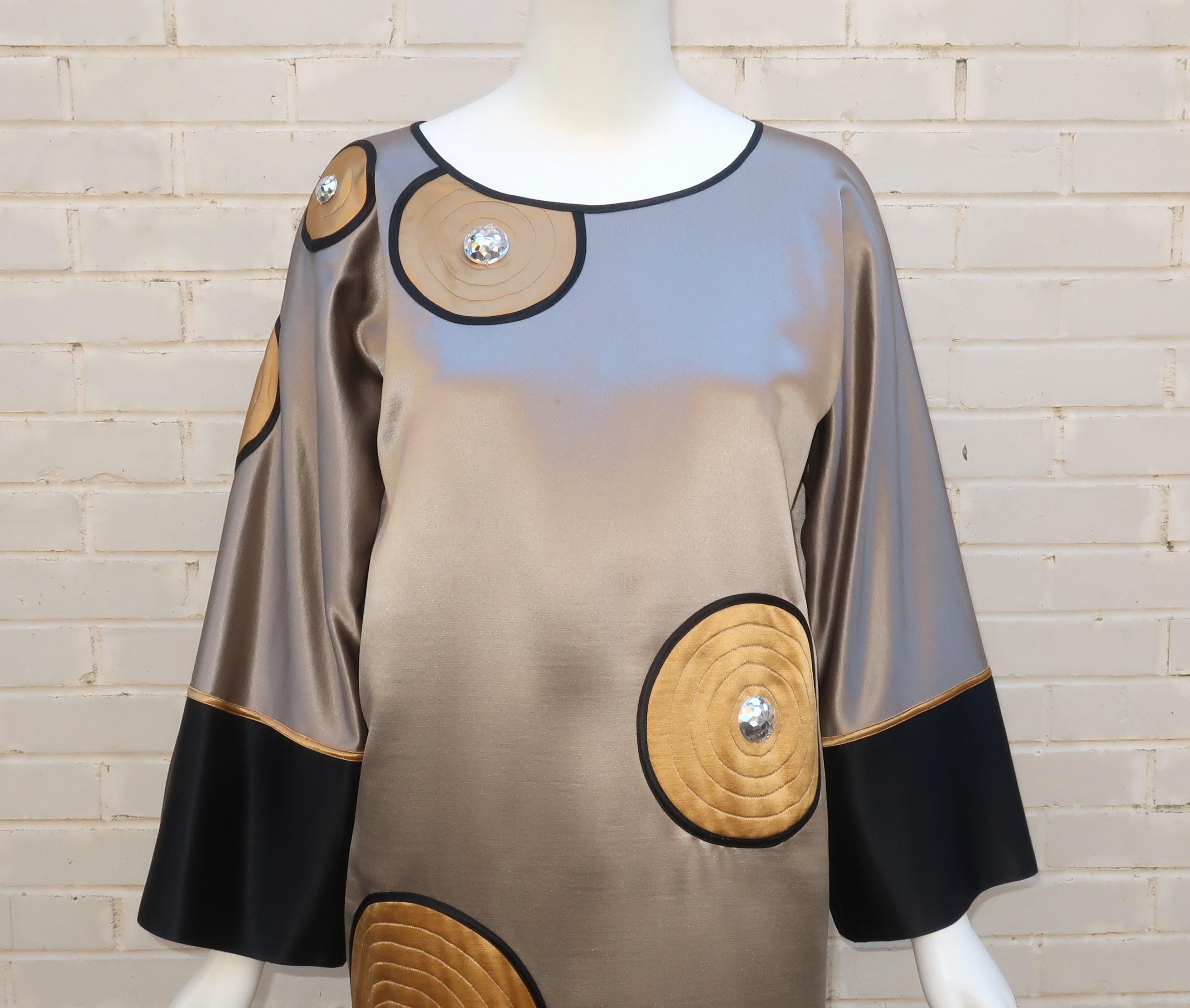 Fall/Winter 1983 Geoffrey Beene shift dress with kimono style sleeves, appliqued circles and 'disco ball' embellishments.  This fabulous dress is simply wearable art with all the wit and chic details one would expect from Geoffrey Beene.  The fabric