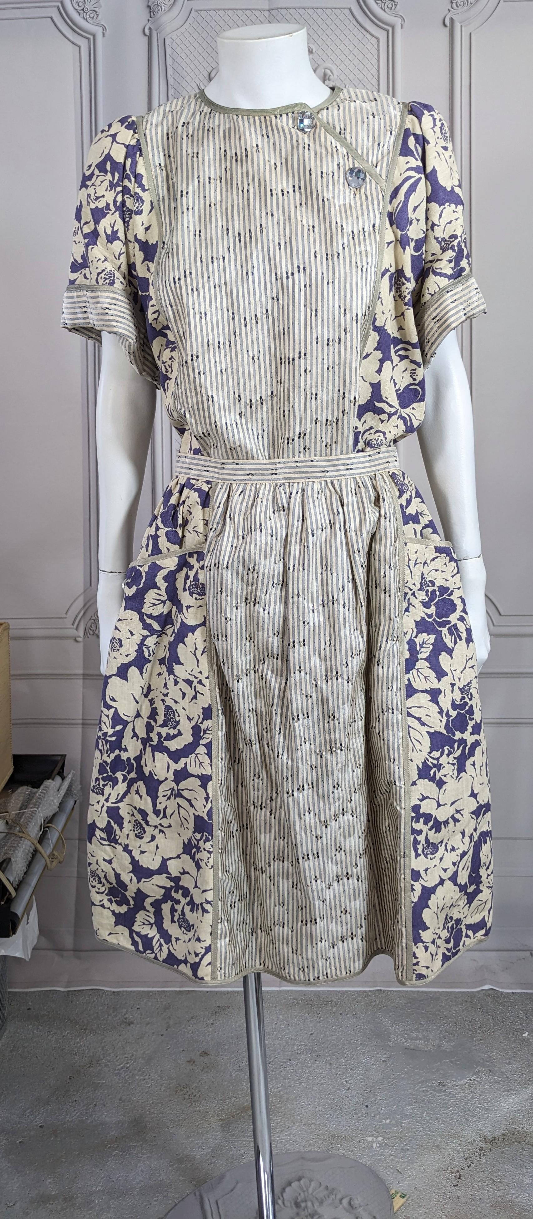 Geoffrey Beene Linen and Silk Taffeta Ensemble from the 1990's. A 2 piece outfit with simple puff sleeved T shirt top and full gathered skirt. As with all Beene pieces, the detailing is exquisite. Purple floral linen is paired with a tonal silk
