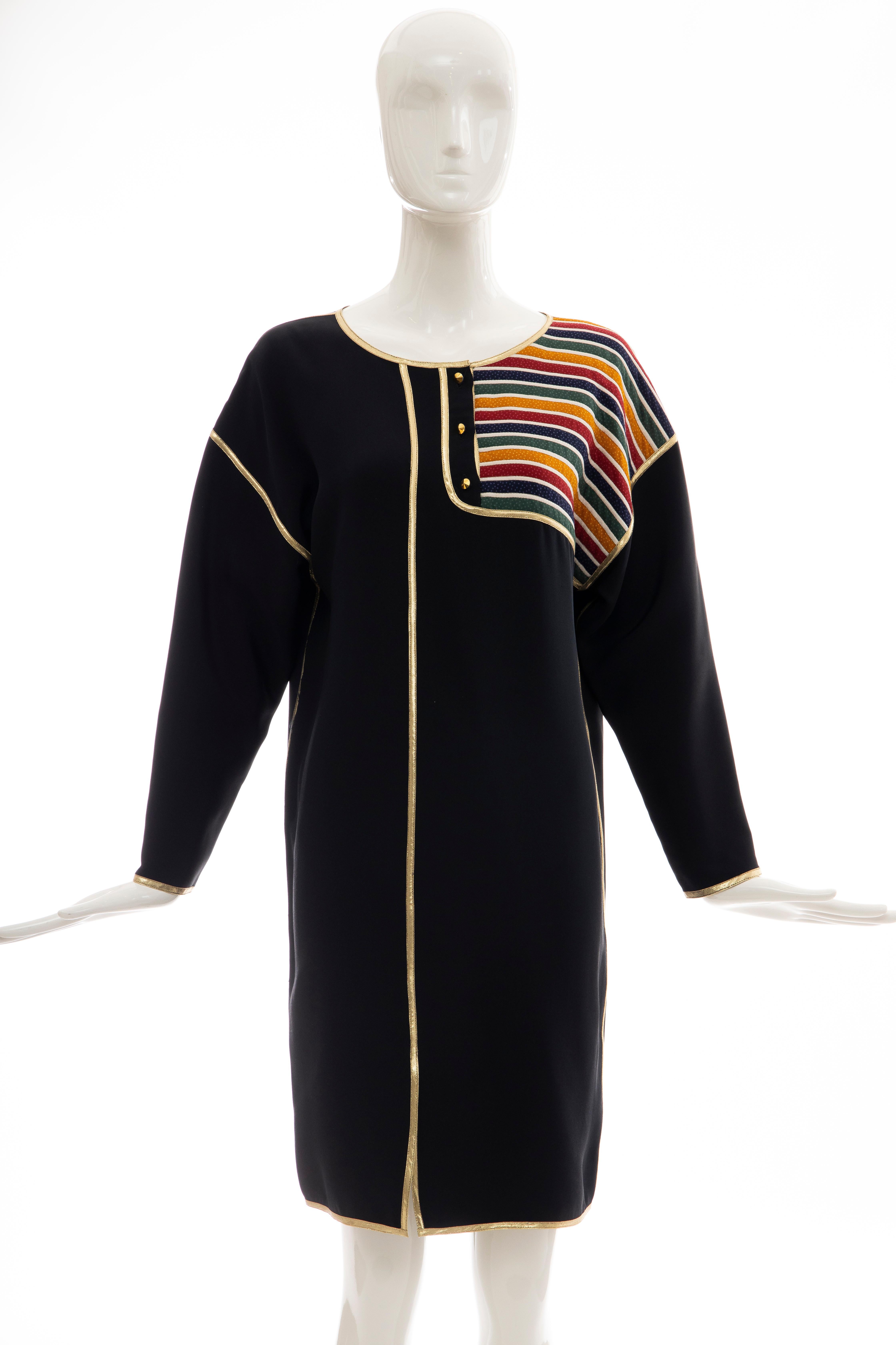 Geoffrey Beene, Fall 1993 silk navy blue multicolored striped quilted button front shift dress with gold lame trim.

US. 6

Bust: 40, Waist: 39, Hips: 39, Shoulder: 22, Sleeve: 18, Length: 37