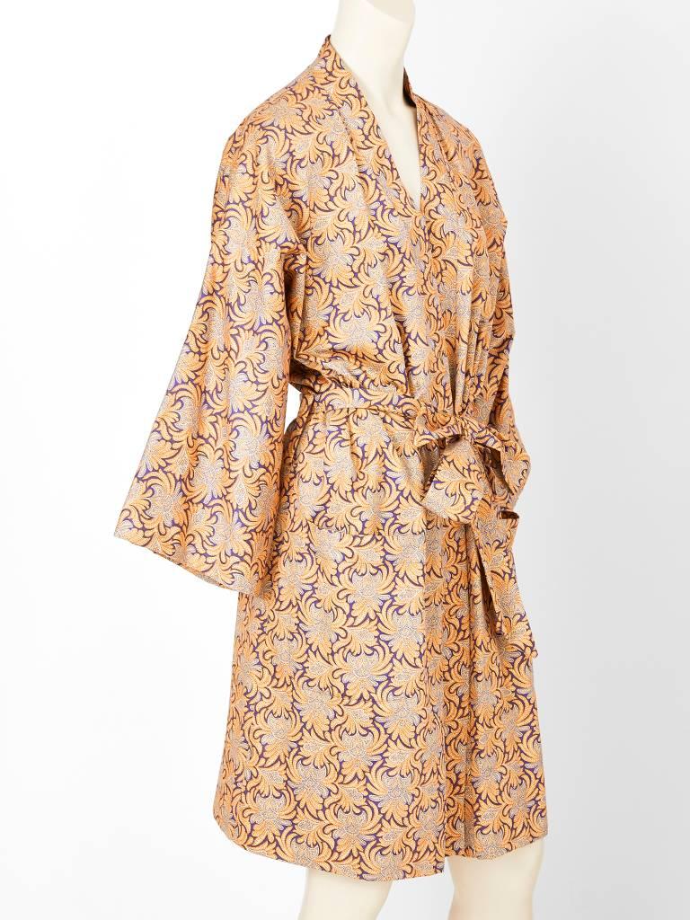 Geoffrey Beene, cotton, patterned, belted kimono having deep patch side pockets and a purple satin lining.